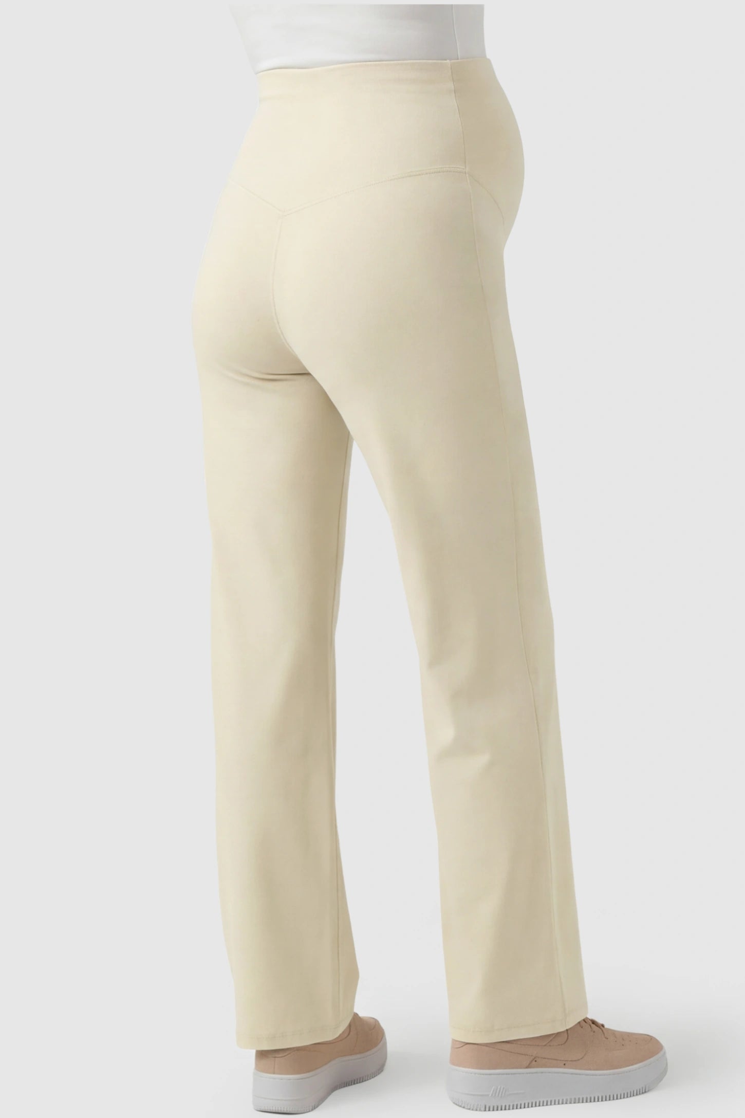 High-Waisted Straight-Leg Maternity Pants High Waisted Straight-Leg Maternity Pants in beige featuring over-the-belly support and standard length fit on pregnant model back view.