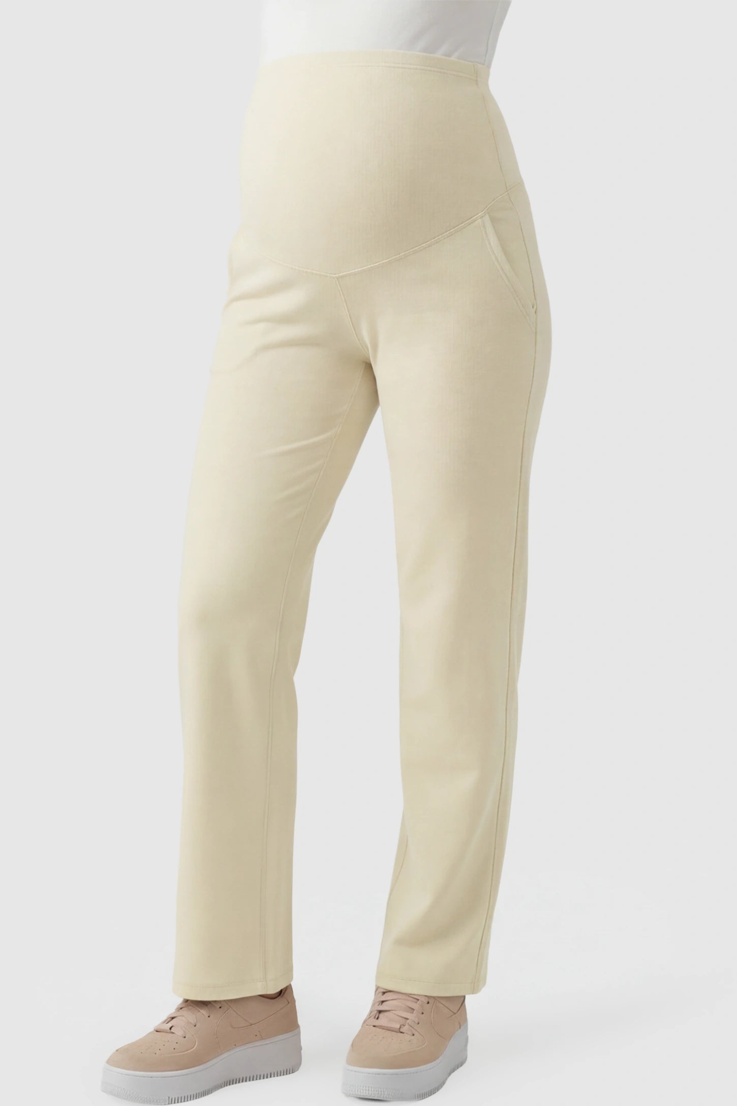 High-Waisted Straight-Leg Maternity Pants High Waisted Straight-Leg Maternity Pants in beige featuring over-the-belly support and standard length fit on pregnant model front view.