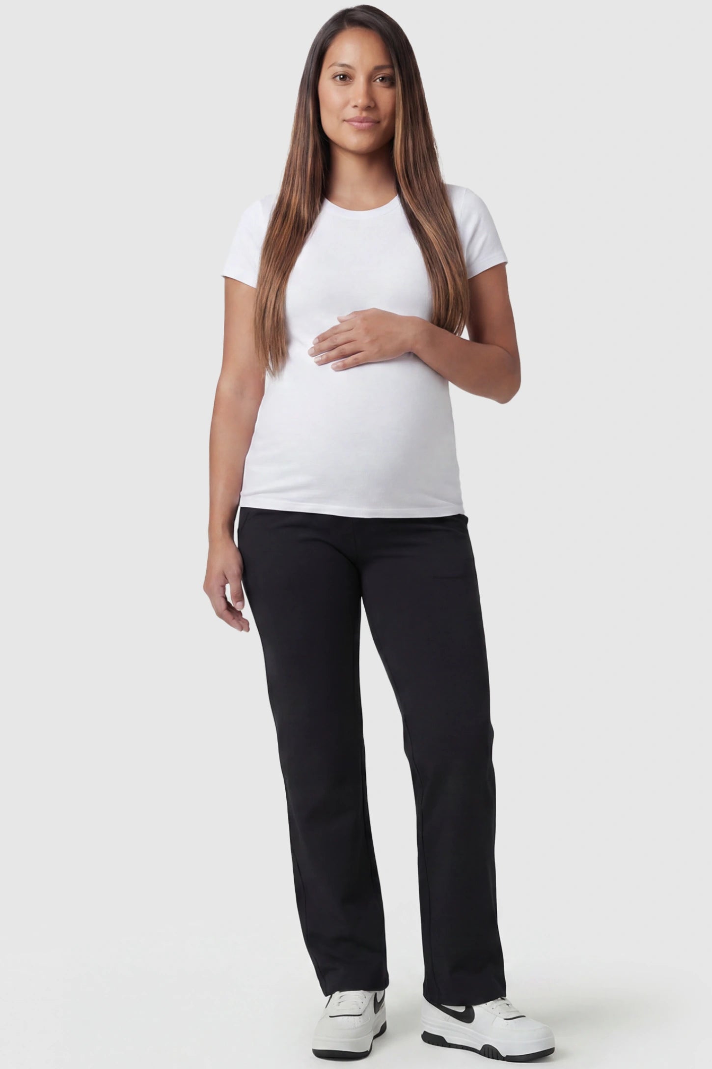 High-Waisted Straight-Leg Maternity Pants High Waisted Straight-Leg Maternity Pants in black featuring over-the-belly support and standard length fit on pregnant model, full body view.