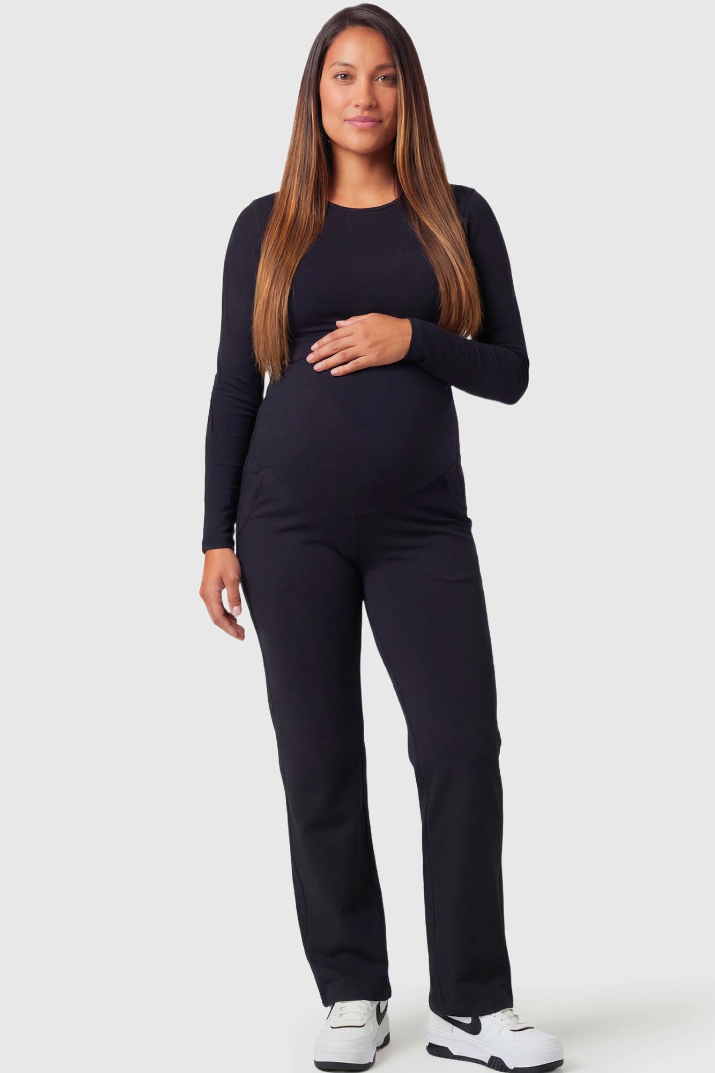 High-Waisted Straight-Leg Maternity Pants High Waisted Straight-Leg Maternity Pants in black featuring over-the-belly support and standard length fit on pregnant model.