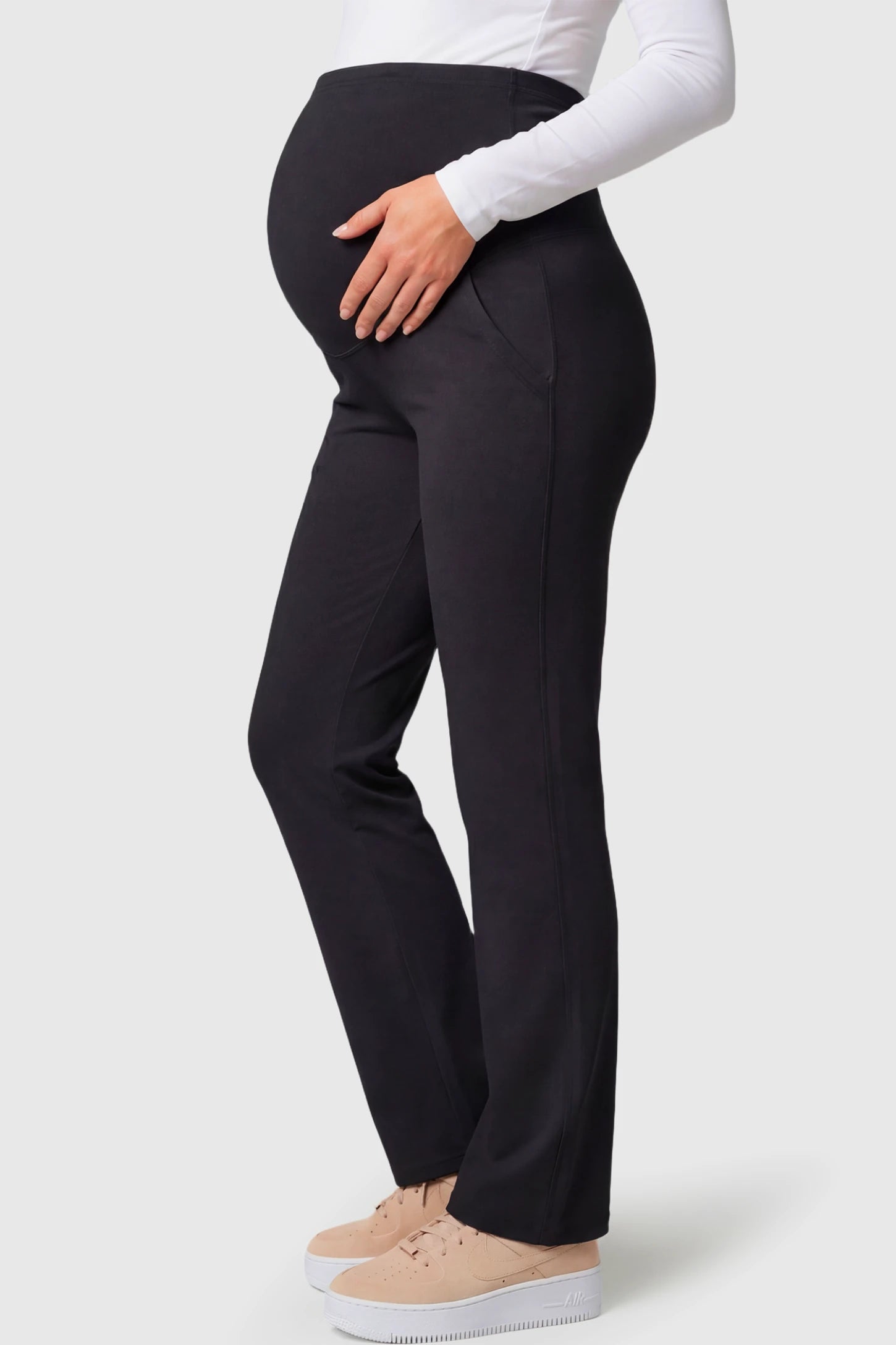 High-Waisted Straight-Leg Maternity Pants High Waisted Straight-Leg Maternity Pants in black featuring over-the-belly support and standard length fit on pregnant model.