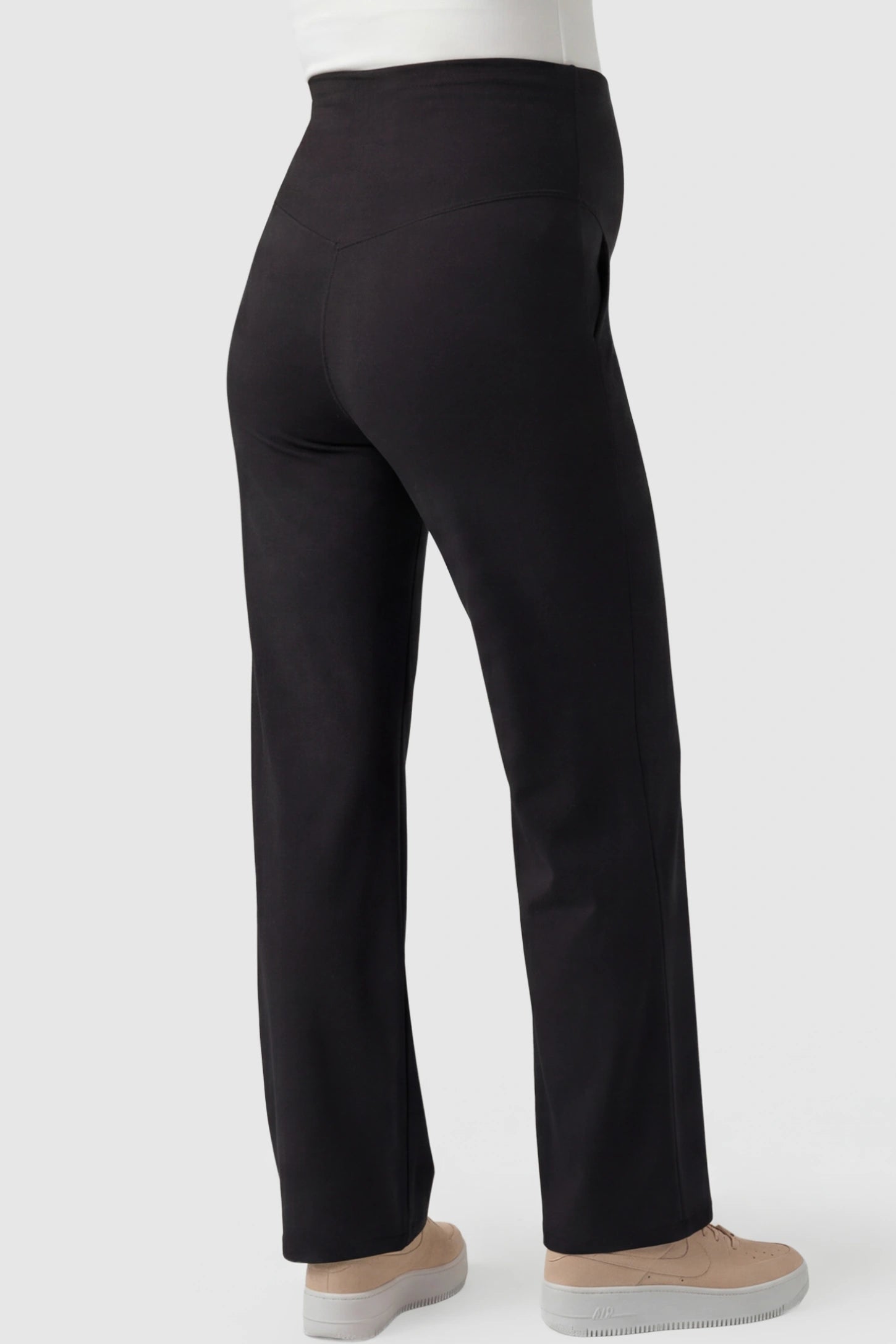 High-Waisted Straight-Leg Maternity Pants High Waisted Straight-Leg Maternity Pants in black featuring over-the-belly support and standard length fit on pregnant model back view.