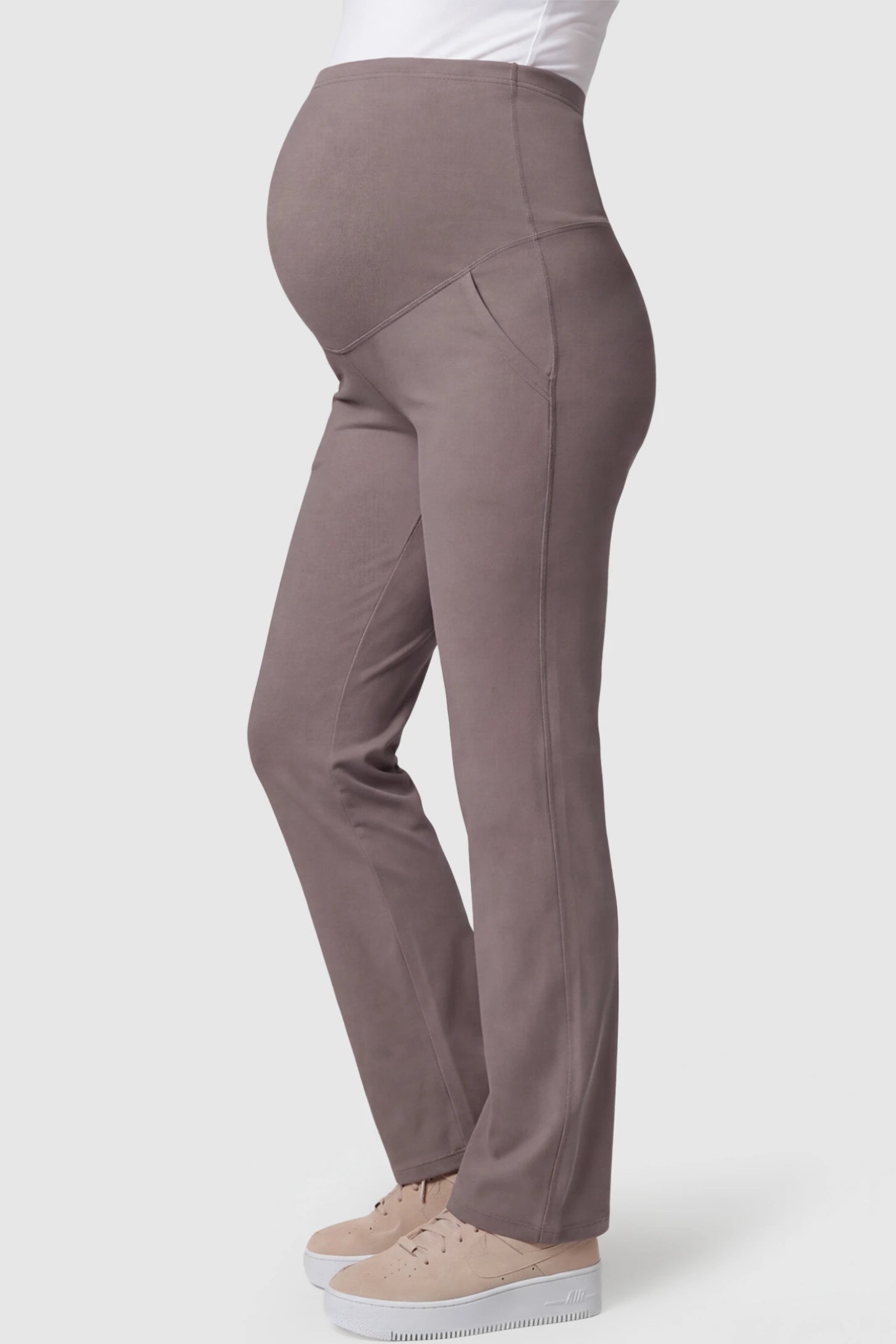 High-Waisted Straight-Leg Maternity Pants High Waisted Straight-Leg Maternity Pants in brown featuring over-the-belly support and standard length fit on pregnant model side view.