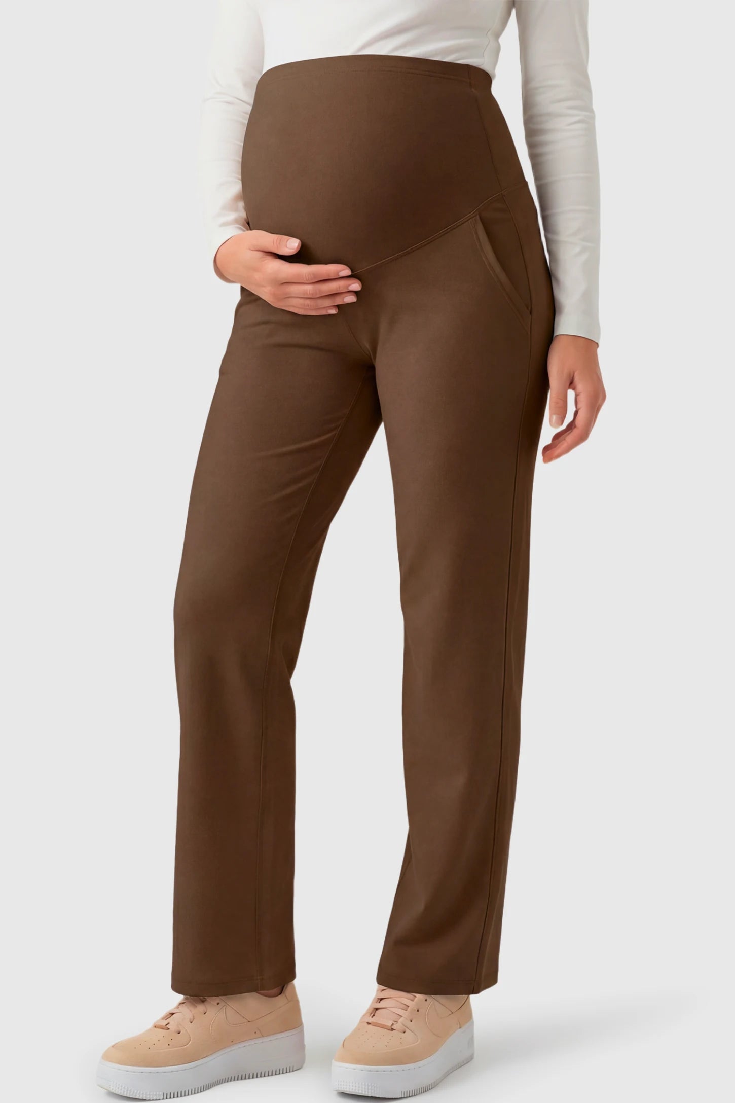 High-Waisted Straight-Leg Maternity Pants High Waisted Straight-Leg Maternity Pants in coffee brown featuring over-the-belly support and standard length fit on pregnant model.