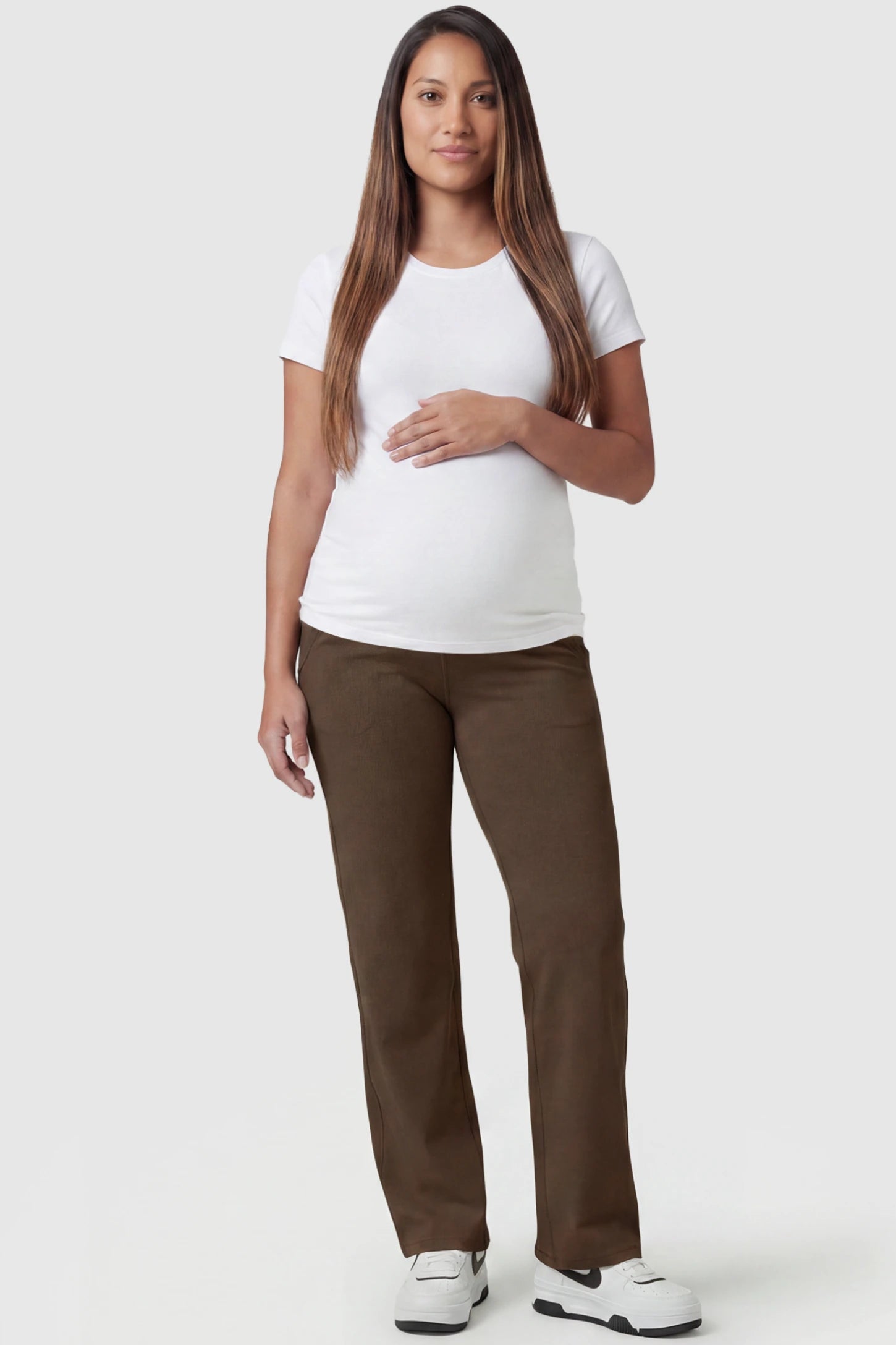 High-Waisted Straight-Leg Maternity Pants High Waisted Straight-Leg Maternity Pants in coffee brown featuring over-the-belly support and standard length fit on pregnant model, full body view.