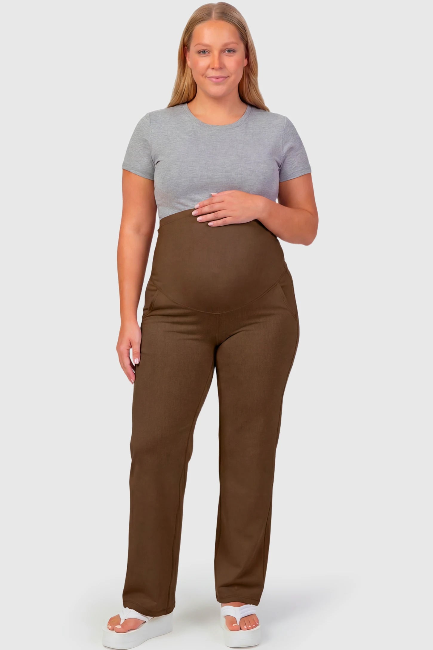 High-Waisted Straight-Leg Maternity Pants High Waisted Straight-Leg Maternity Pants in coffee brown featuring over-the-belly support and standard length fit on plus size pregnant model.