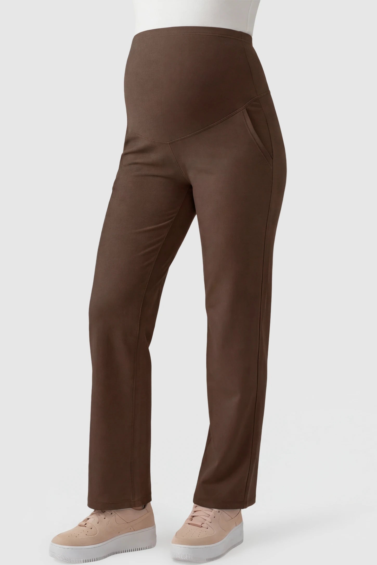 High-Waisted Straight-Leg Maternity Pants High Waisted Straight-Leg Maternity Pants in Coffee Brown featuring over-the-belly support and standard length fit on pregnant model front view.