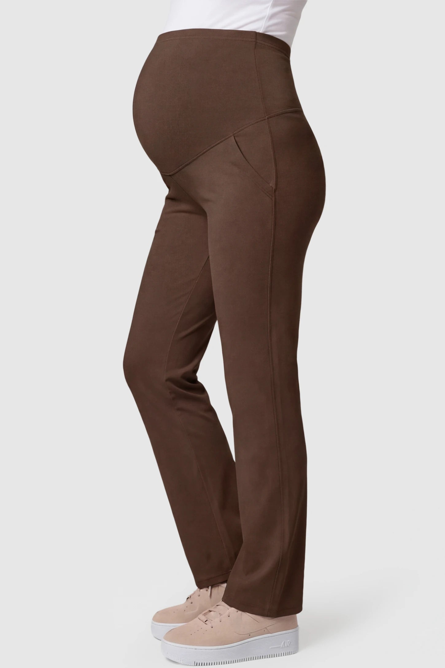 High-Waisted Straight-Leg Maternity Pants High Waisted Straight-Leg Maternity Pants in Coffee Brown featuring over-the-belly support and standard length fit on pregnant model side view.