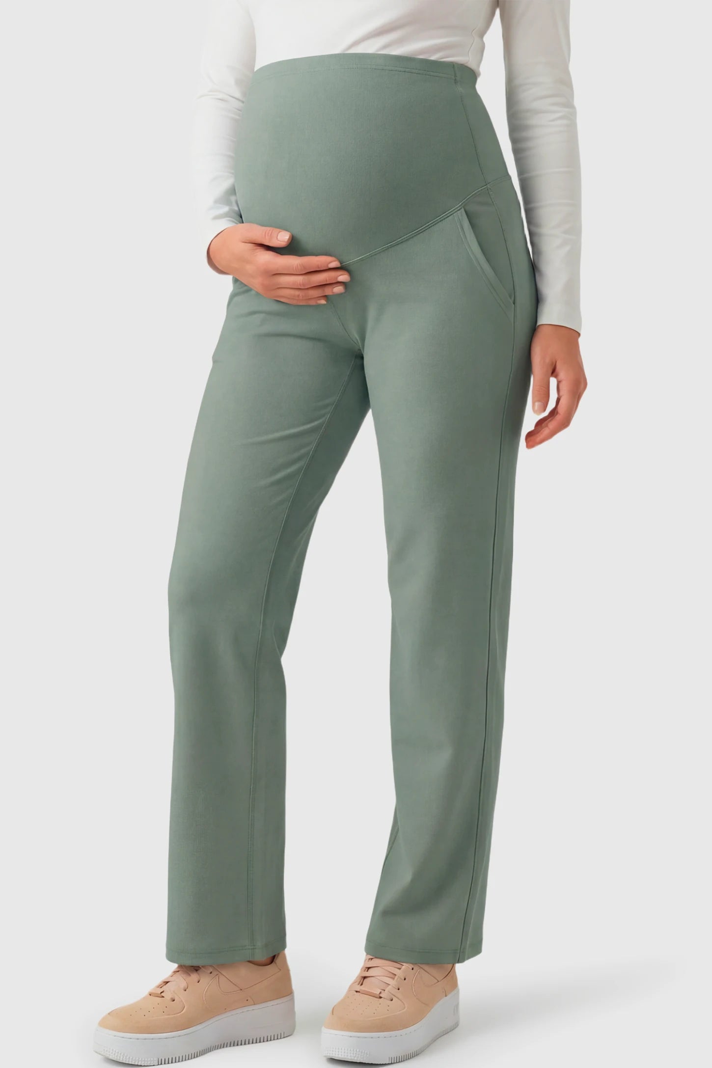 High-Waisted Straight-Leg Maternity Pants High Waisted Straight-Leg Maternity Pants in grayish green featuring over-the-belly support and standard length fit on pregnant model.