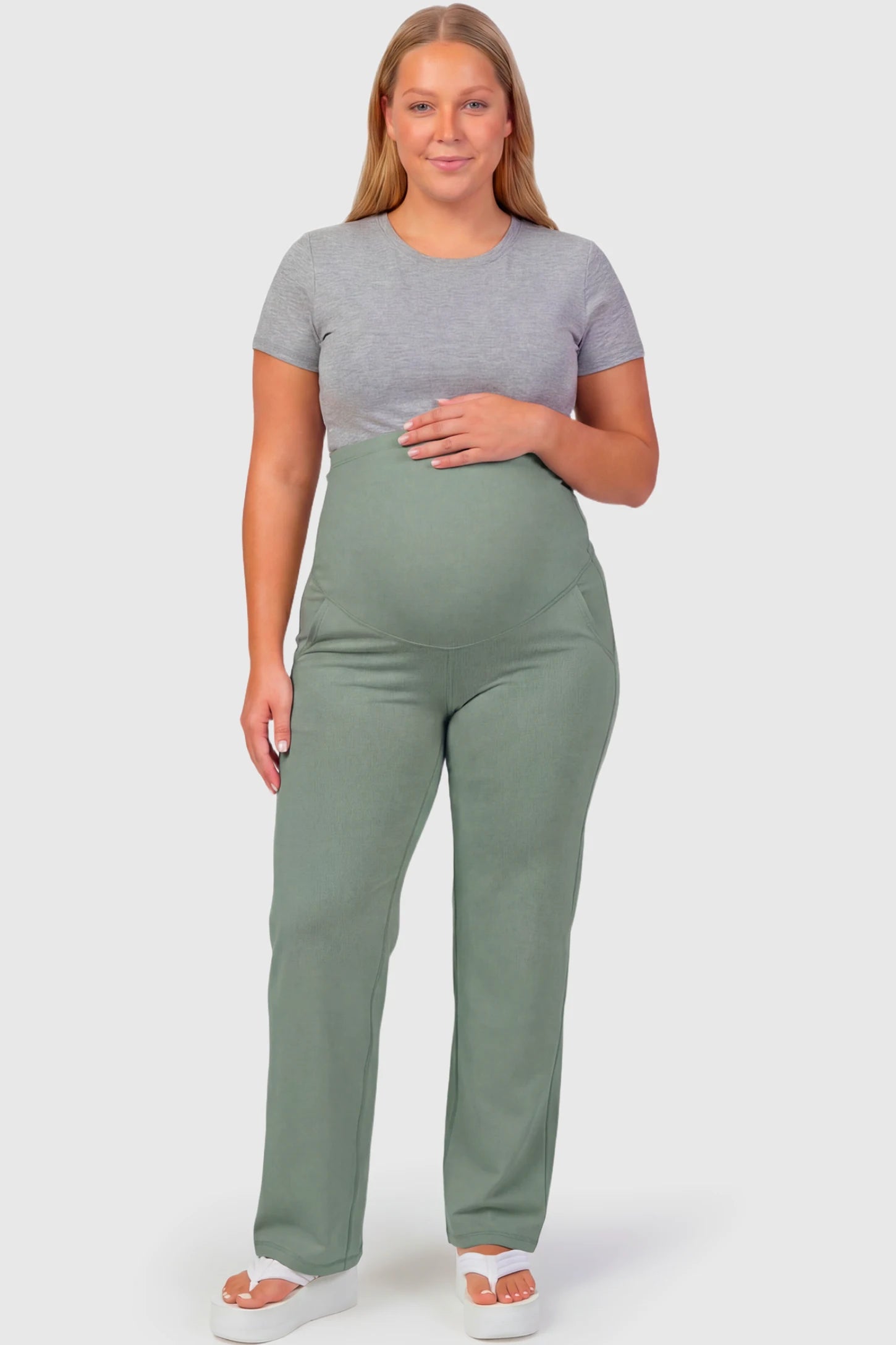 High-Waisted Straight-Leg Maternity Pants High Waisted Straight-Leg Maternity Pants in grayish green featuring over-the-belly support and standard length fit on plus size pregnant model.