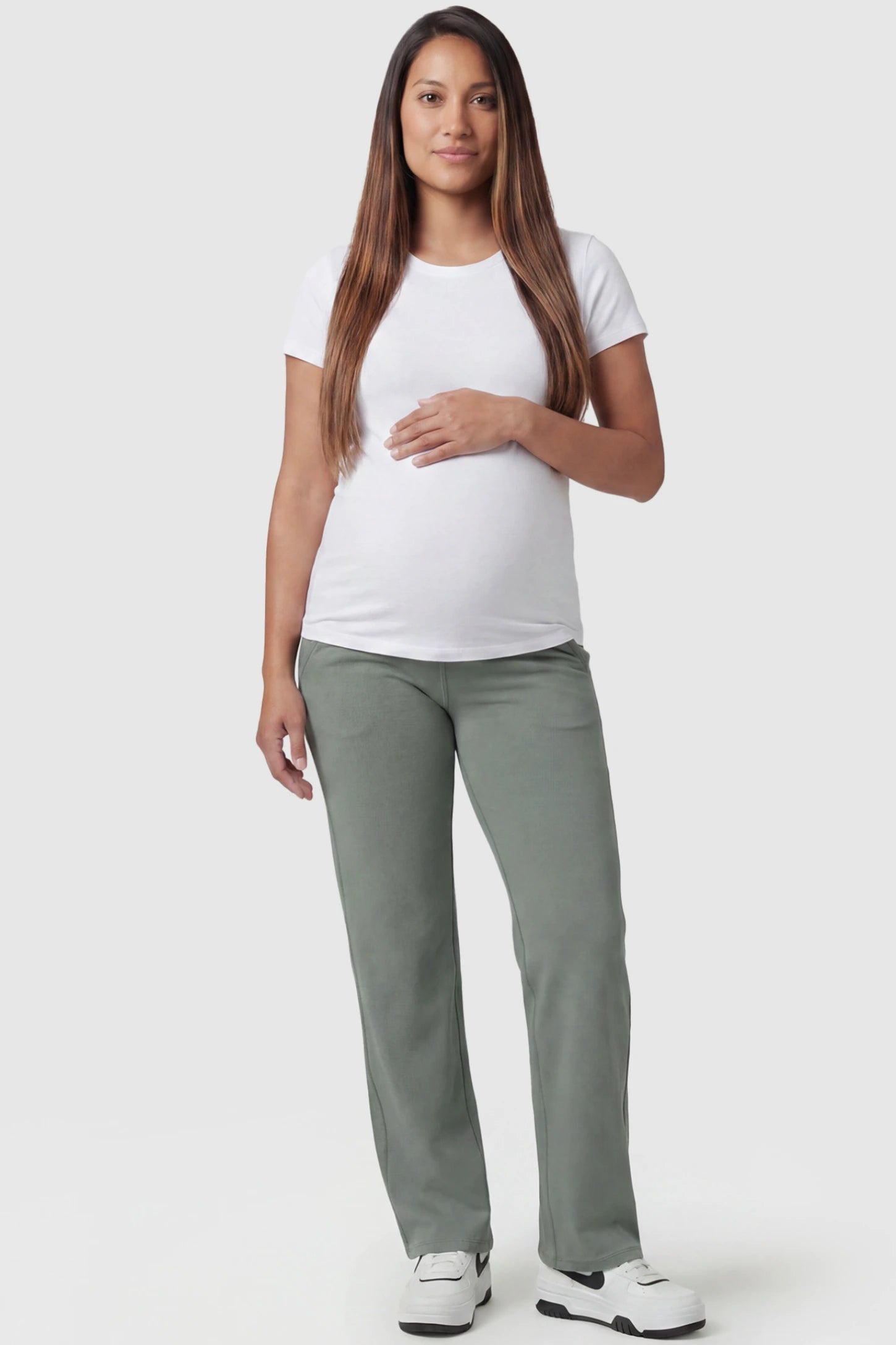 High-Waisted Straight-Leg Maternity Pants High Waisted Straight-Leg Maternity Pants in green featuring over-the-belly support and standard length fit on pregnant model, full body view.