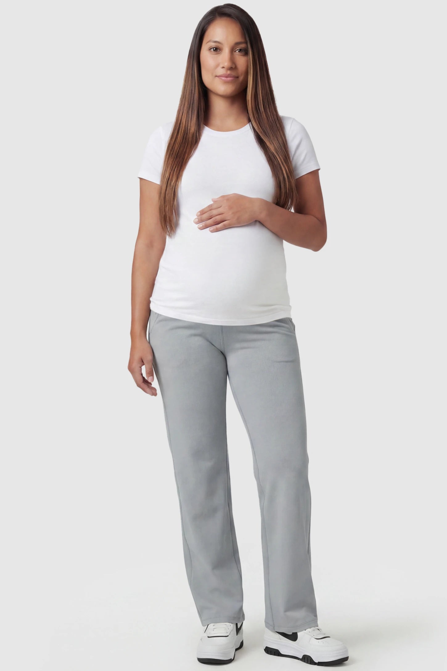 High-Waisted Straight-Leg Maternity Pants High Waisted Straight-Leg Maternity Pants in light gray featuring over-the-belly support and standard length fit on pregnant model, full body view.