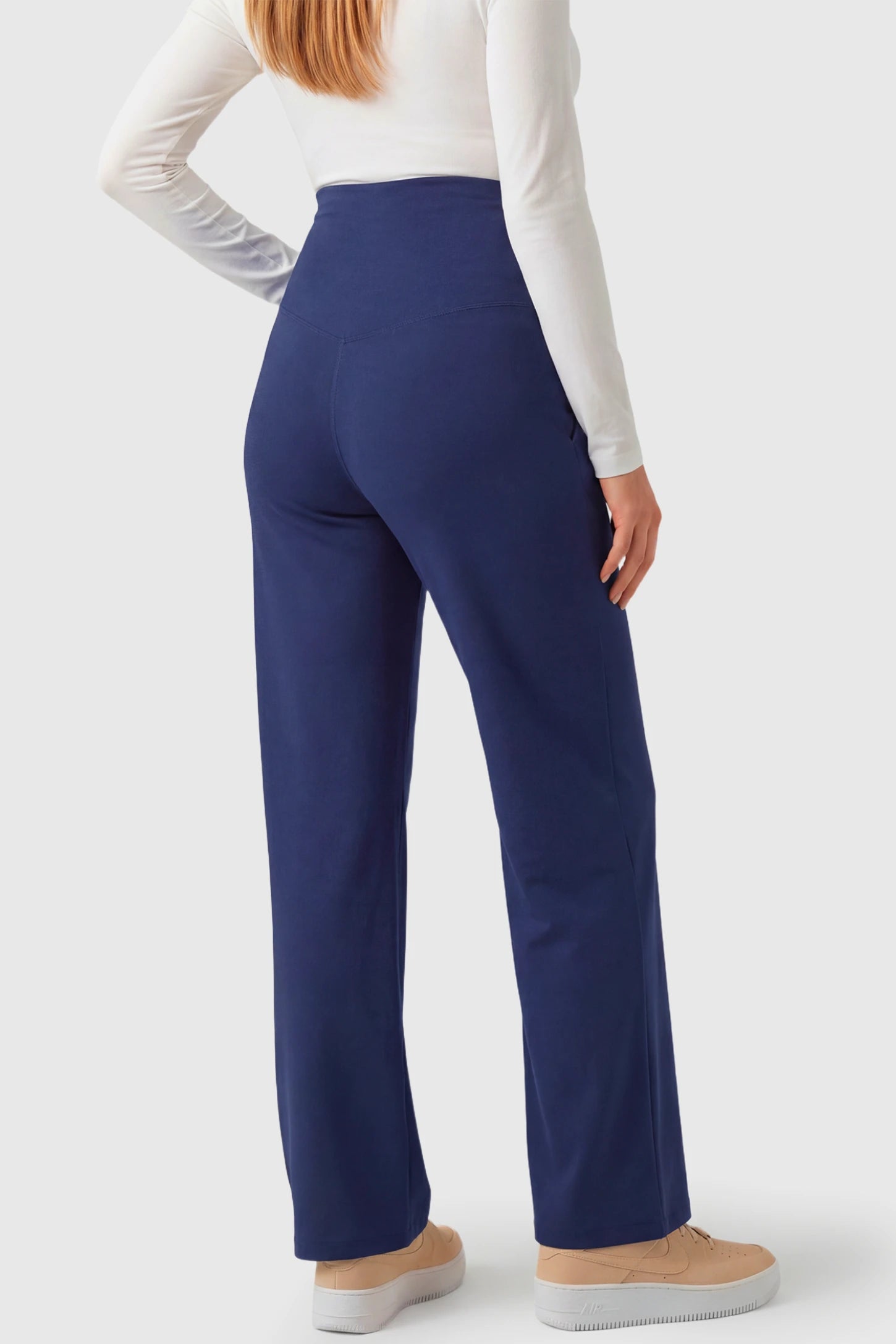 High-Waisted Straight-Leg Maternity Pants High Waisted Straight-Leg Maternity Pants in navy blue featuring over-the-belly support and standard length fit on pregnant model.