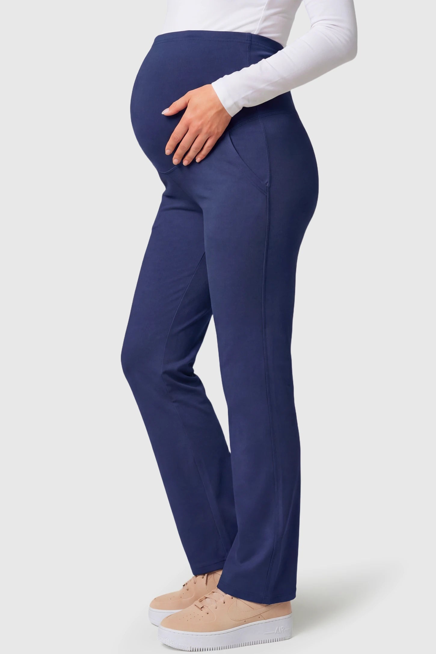 High-Waisted Straight-Leg Maternity Pants High Waisted Straight-Leg Maternity Pants in navy blue featuring over-the-belly support and standard length fit on pregnant model.