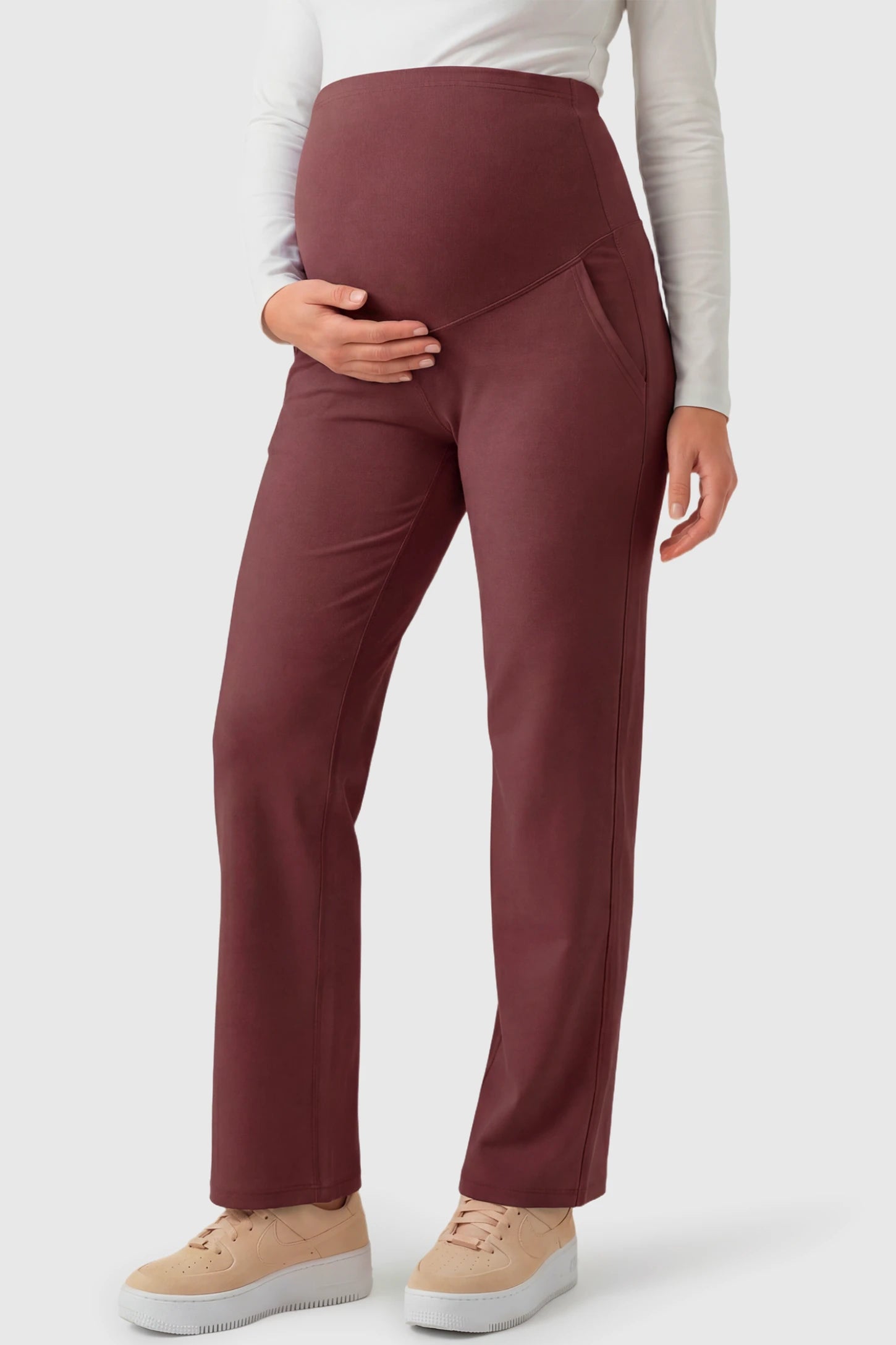 High Waisted Straight-Leg Maternity Pants in wine red featuring over-the-belly support and standard length fit on pregnant model.