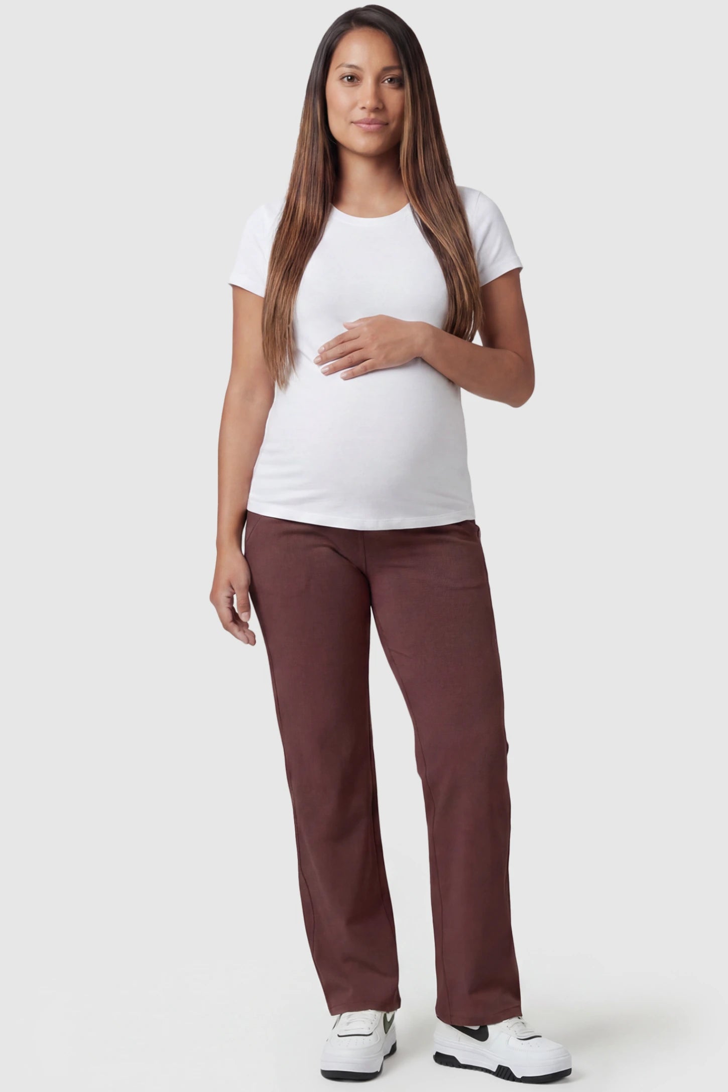 High-Waisted Straight-Leg Maternity Pants High Waisted Straight-Leg Maternity Pants in wine red featuring over-the-belly support and standard length fit on pregnant model, full body view.