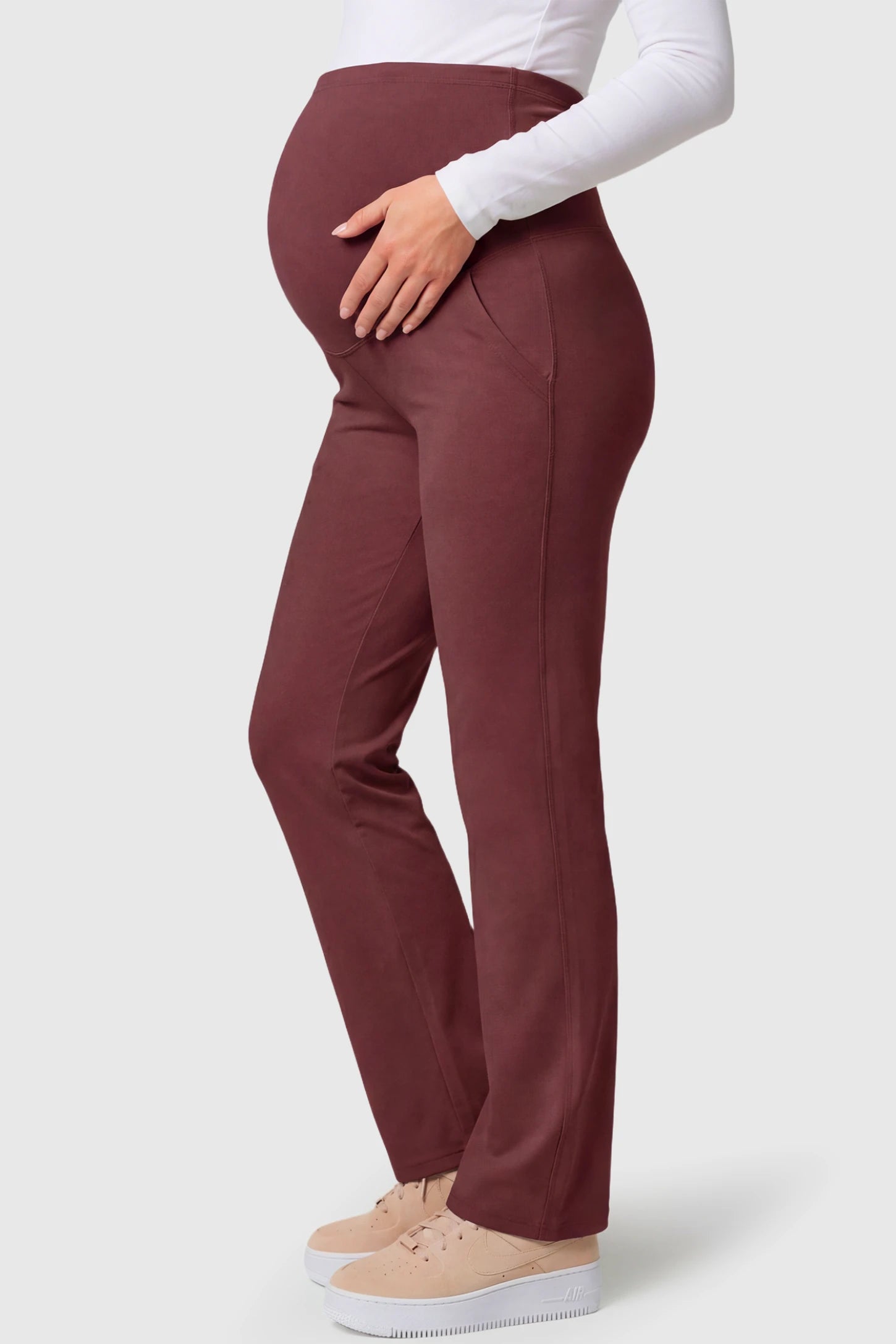 High-Waisted Straight-Leg Maternity Pants High Waisted Straight-Leg Maternity Pants in wine red featuring over-the-belly support and standard length fit on pregnant model.