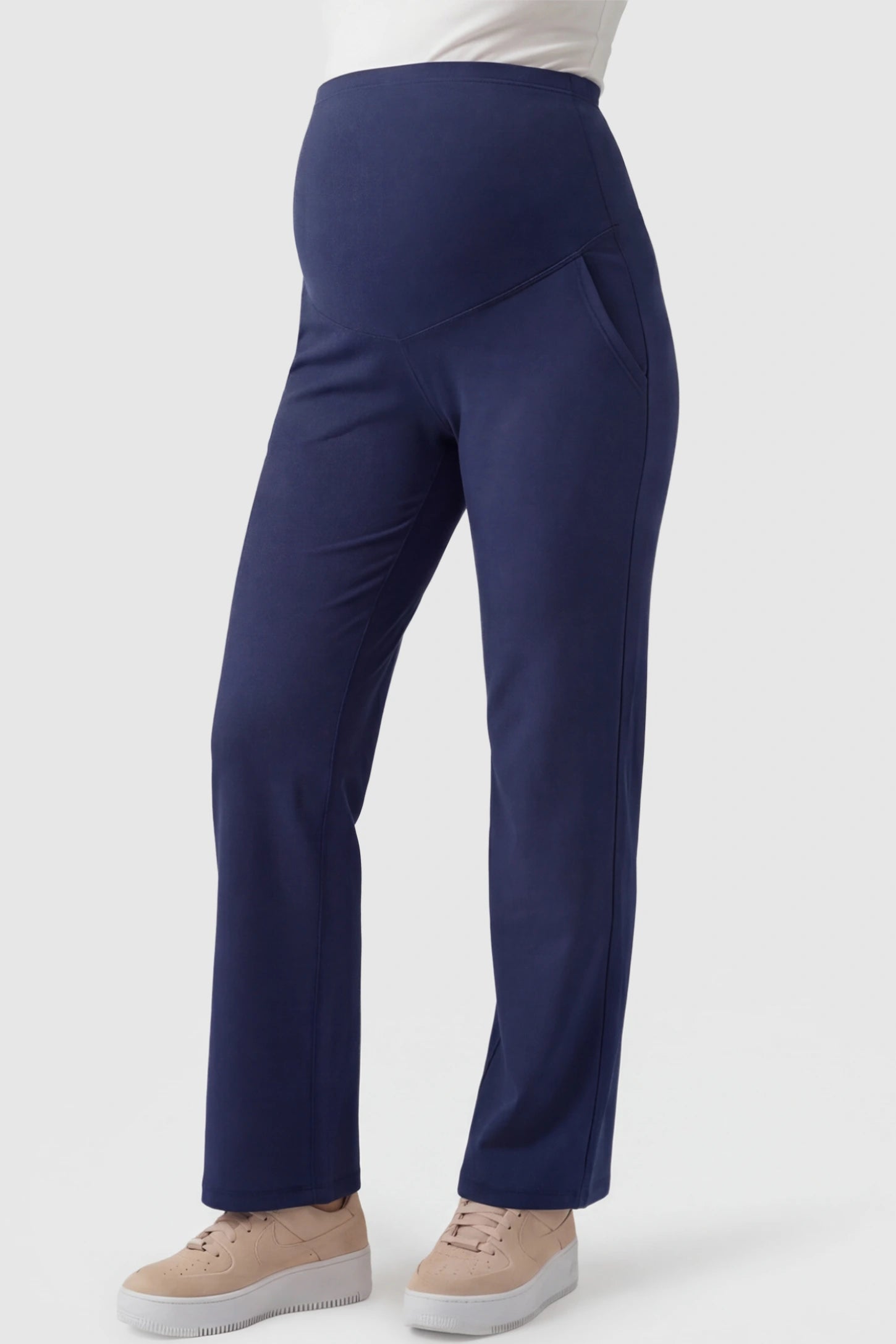 High-Waisted Straight-Leg Maternity Pants High Waisted Straight-Leg Maternity Pants in navy blue featuring over-the-belly support and standard length fit on pregnant model front view.