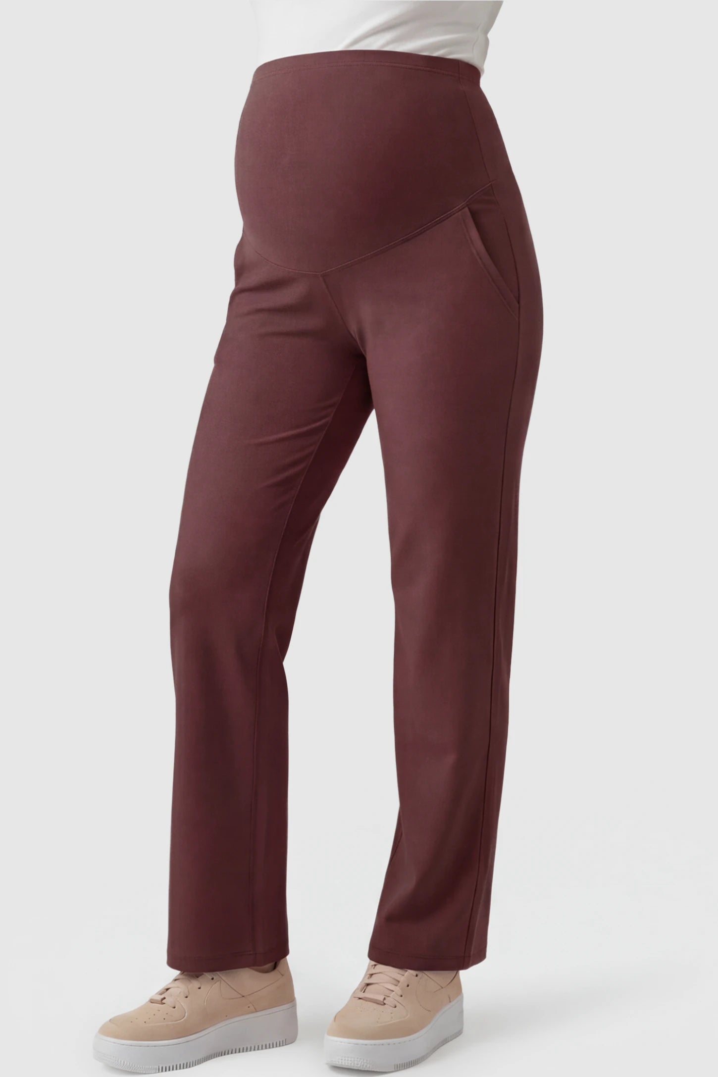 High-Waisted Straight-Leg Maternity Pants High Waisted Straight-Leg Maternity Pants in wine red featuring over-the-belly support and standard length fit on pregnant model front view.