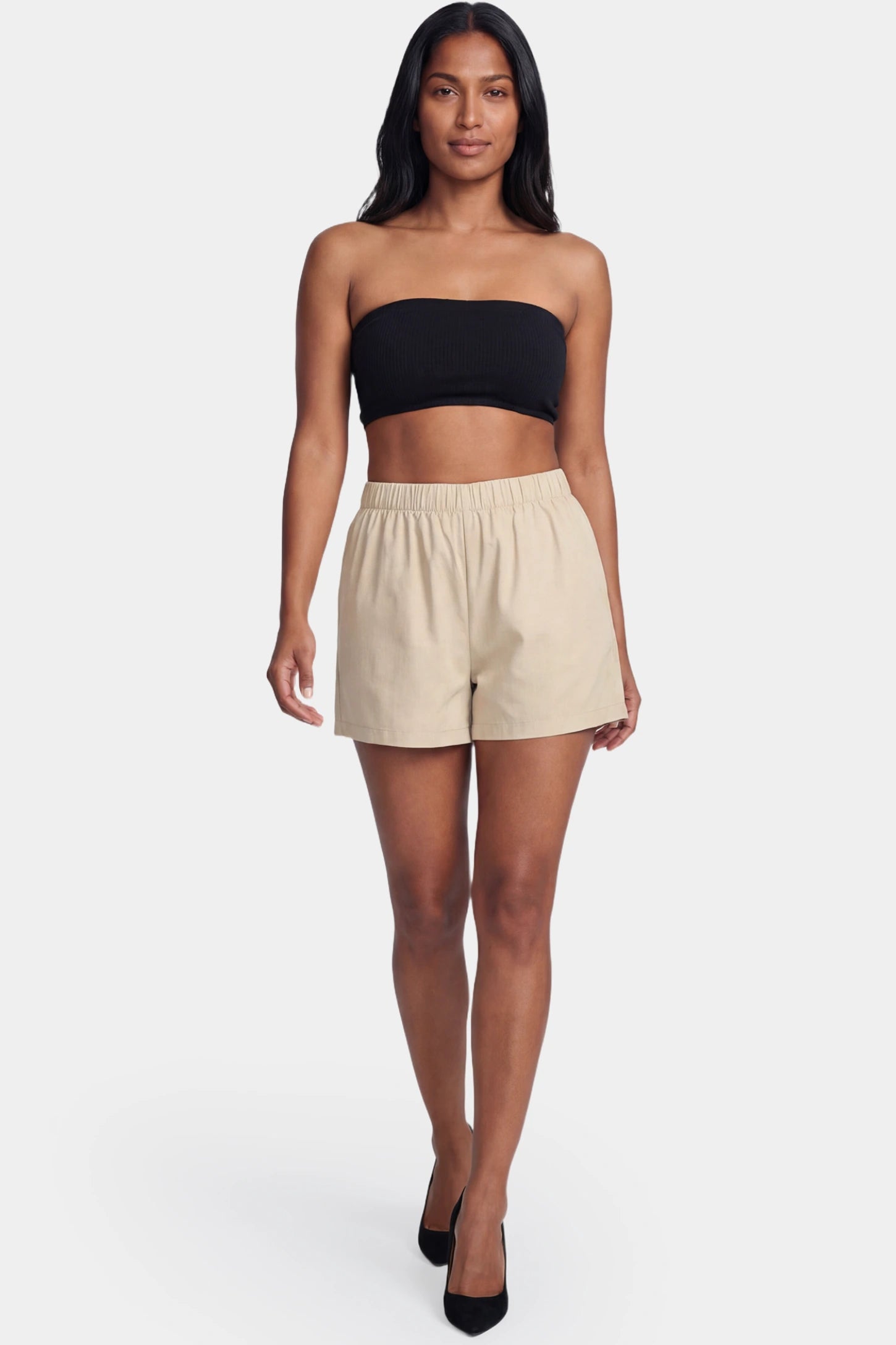 Color-Block Strapless High-Waist Flared Mini Maternity Dress Color-block strapless high-waist flared mini maternity dress in black and apricot featuring strapless neckline in front view on a postpartum model