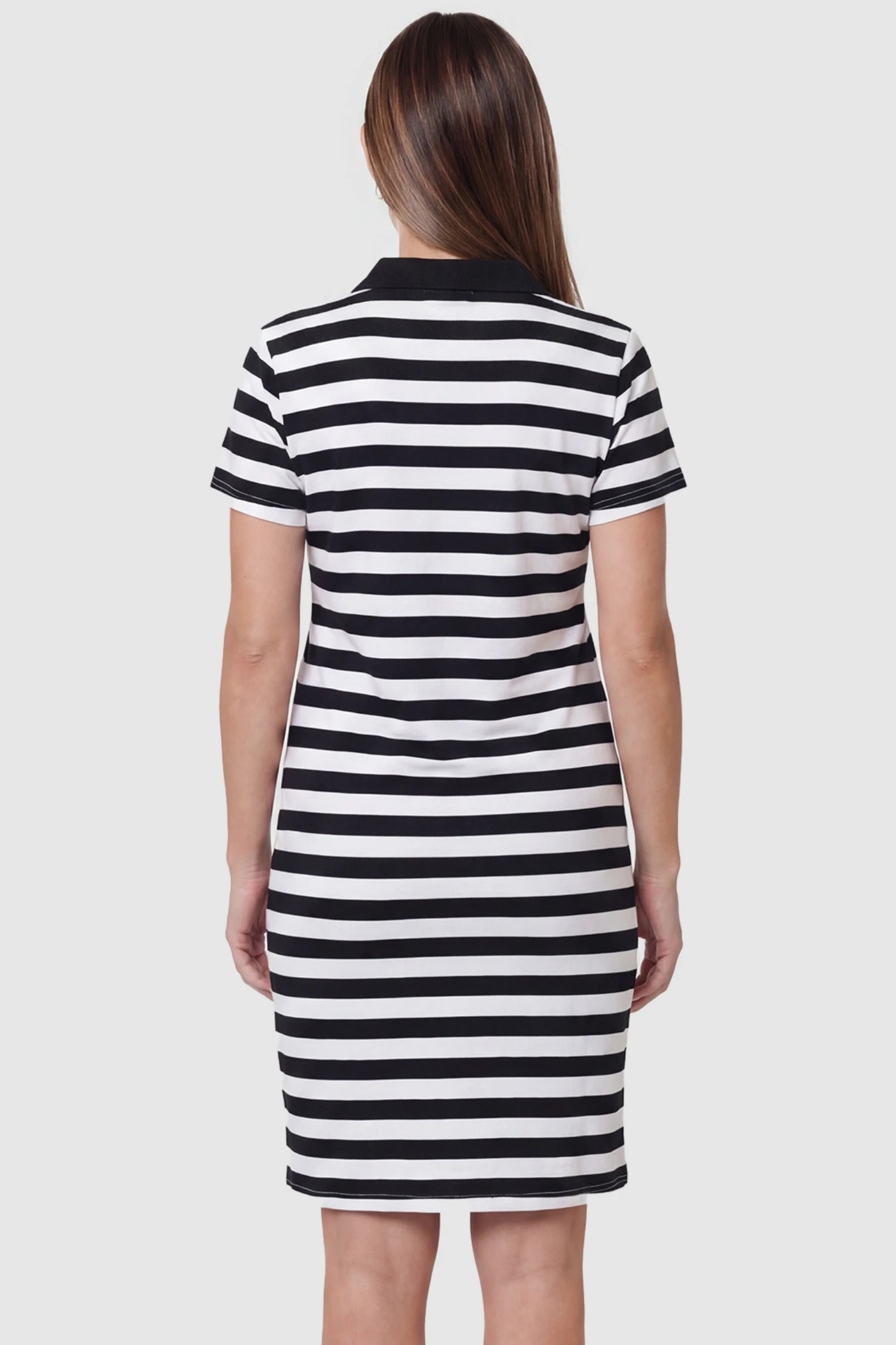 Striped Collared Nursing T-Shirt Dress Striped Collared Nursing T-Shirt Dress in Black and White Stripes featuring a comfortable mini-length cut on a pregnant model.