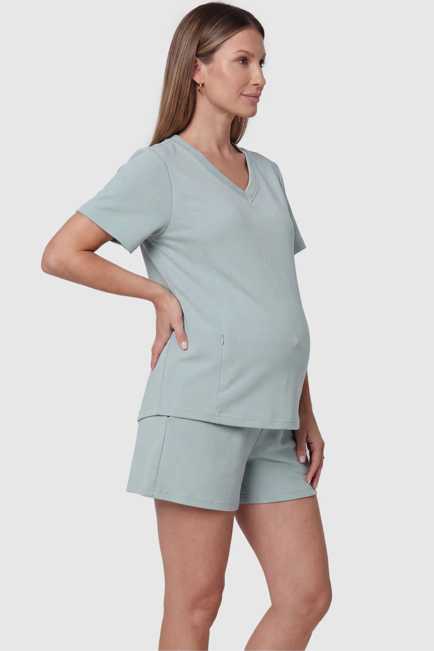 Soft Stretch Short Sleeve Maternity & Nursing Lounge Set Soft Stretch Short Sleeve Maternity & Nursing Lounge Set in light green featuring V-neck top, and relaxed short on pregnant model.