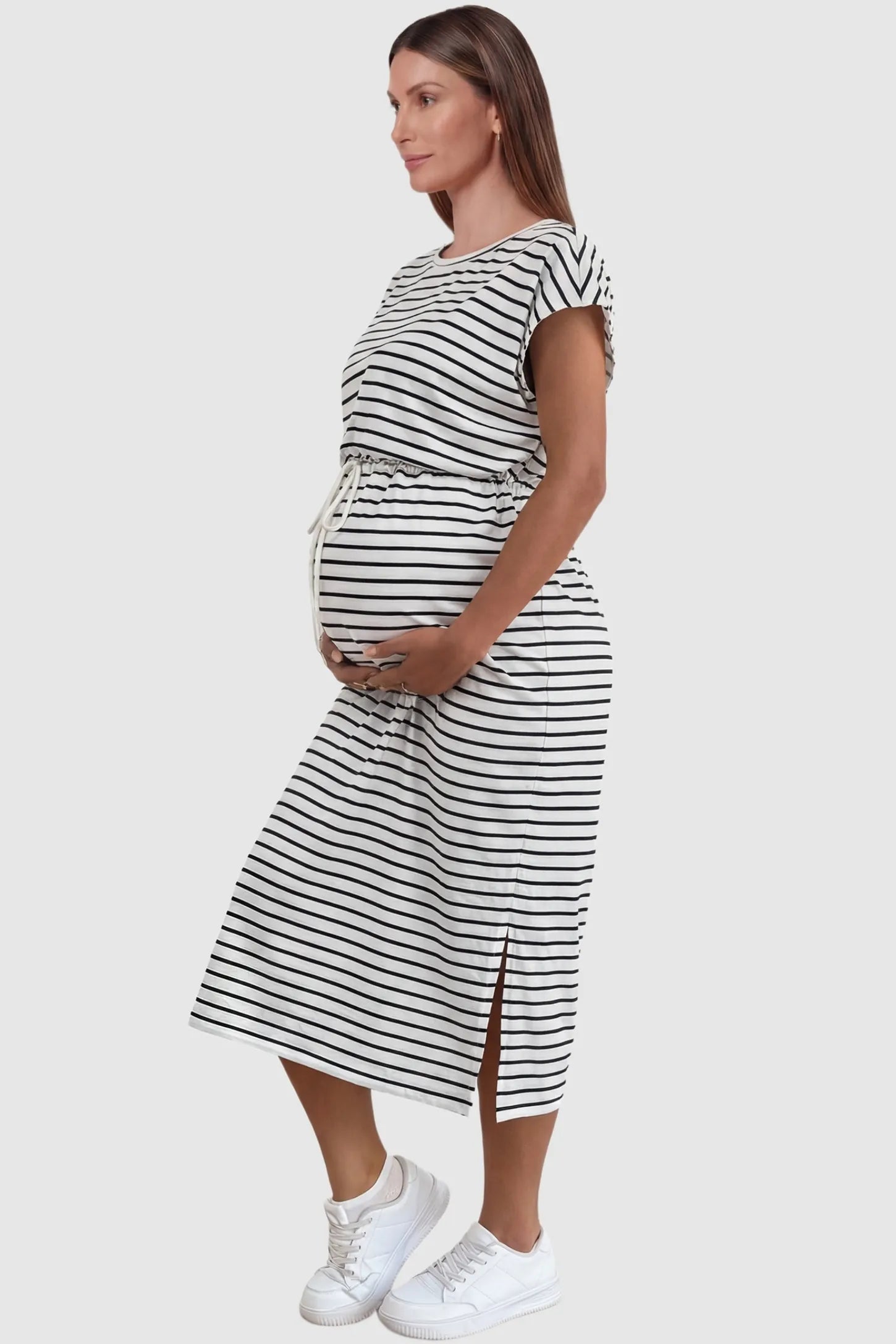 Striped Batwing Sleeve Maternity Dress Striped Batwing Sleeve Maternity Dress in black and white stripes featuring side slits on a side-profile pregnant model.