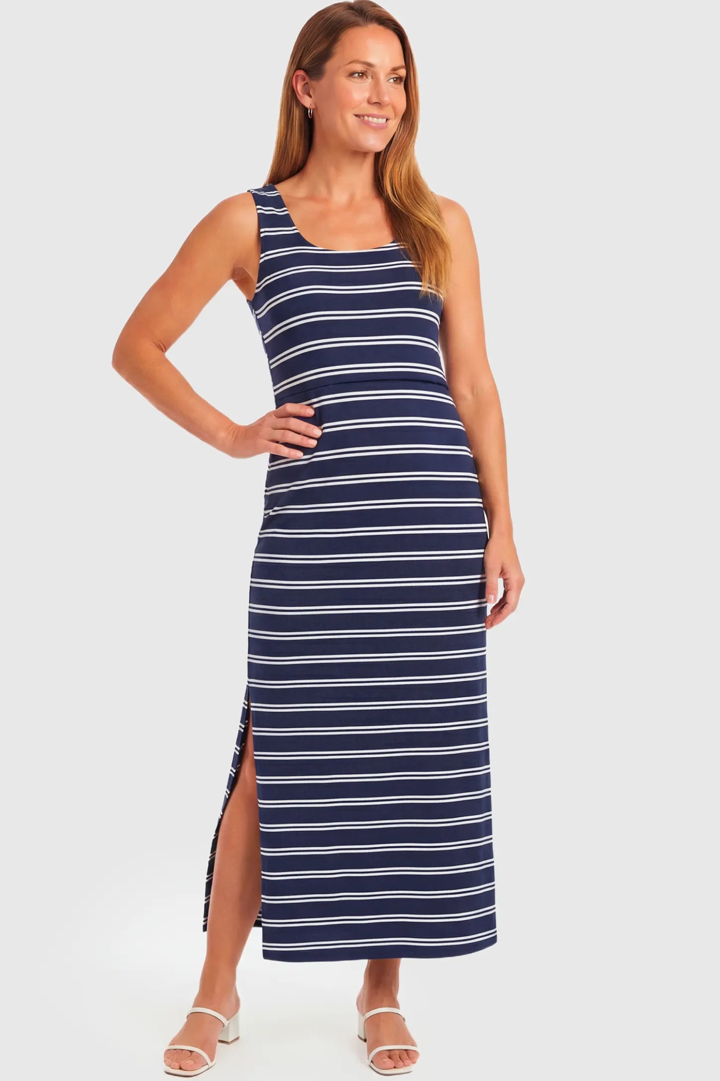 Sleeveless Scoop Neck Maternity & Nursing Midi Dress Sleeveless Scoop Neck Maternity & Nursing Midi Dress in navy stripe pattern featuring scoop neckline and side slit on a non pregnant model.