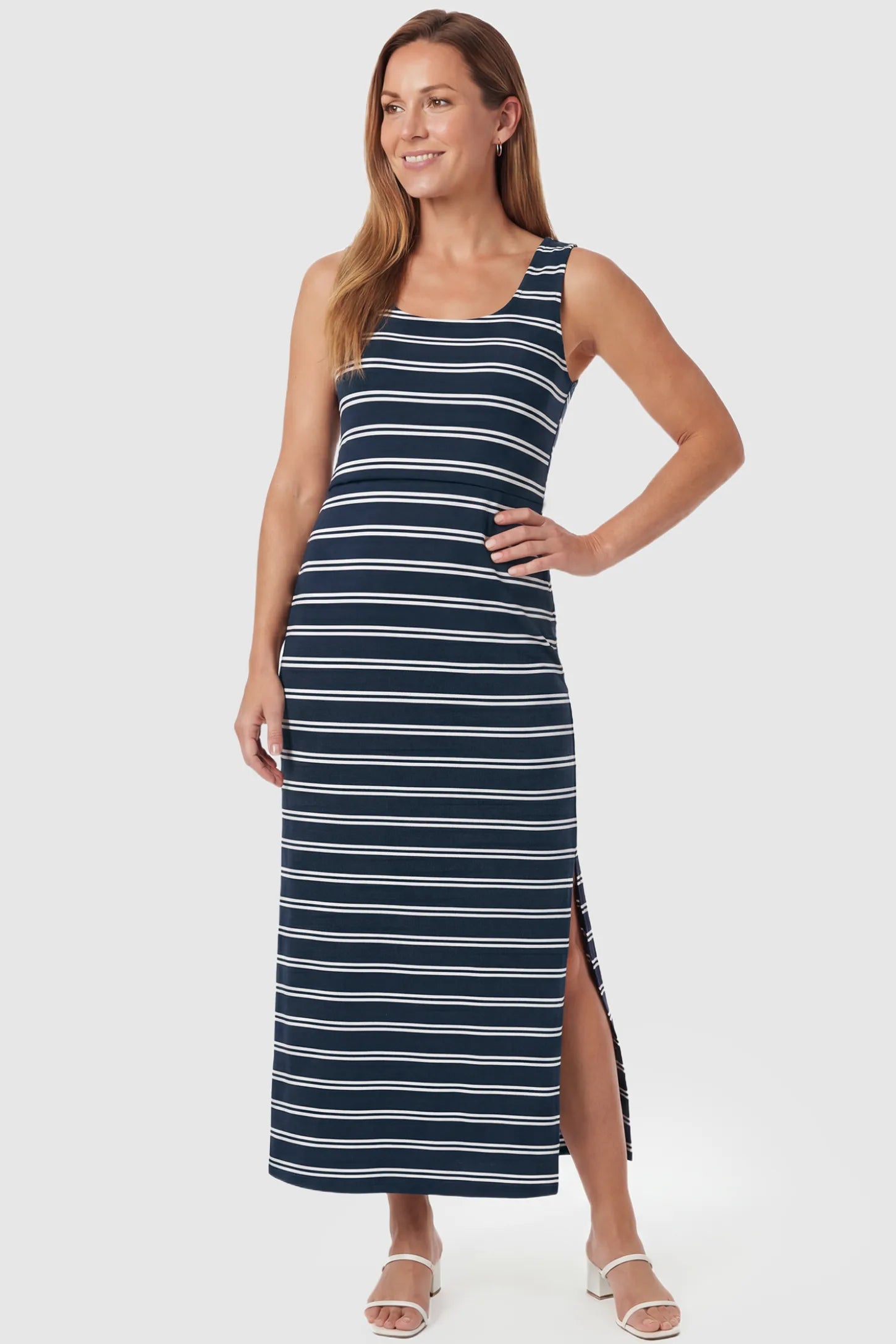 Sleeveless Scoop Neck Maternity & Nursing Midi Dress Sleeveless Scoop Neck Maternity & Nursing Midi Dress in dark blue stripes with classic stripes and side slit, front view on postpartum model