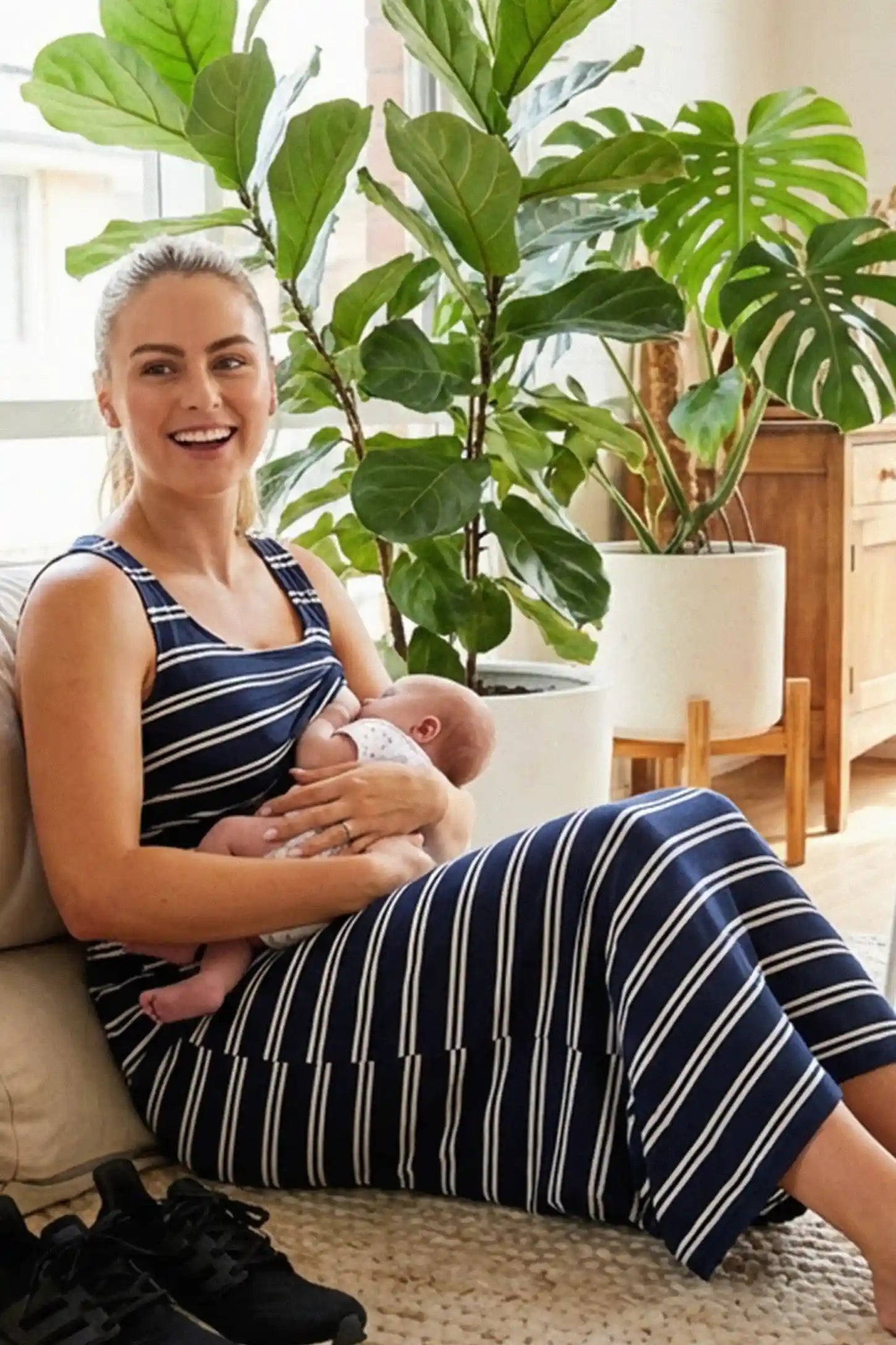 Sleeveless Scoop Neck Maternity & Nursing Midi Dress Sleeveless Scoop Neck Maternity & Nursing Midi Dress in dark blue stripes with easy nursing access, front view on pregnant model