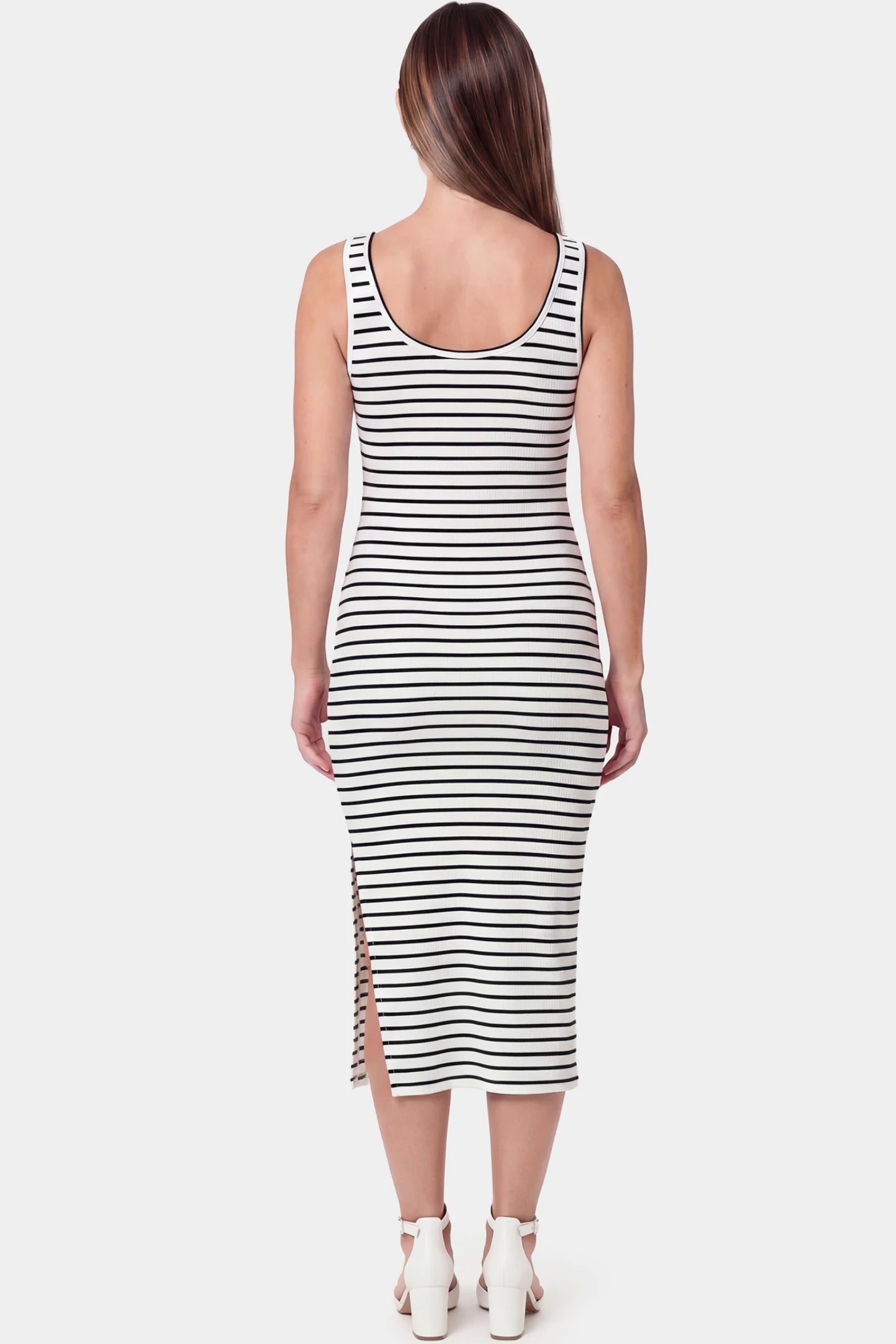 Striped Spaghetti Strap Side Slit Midi Maternity Dress Striped spaghetti strap side slit midi maternity dress in white featuring sleeveless spaghetti straps in back view on a pregnant model