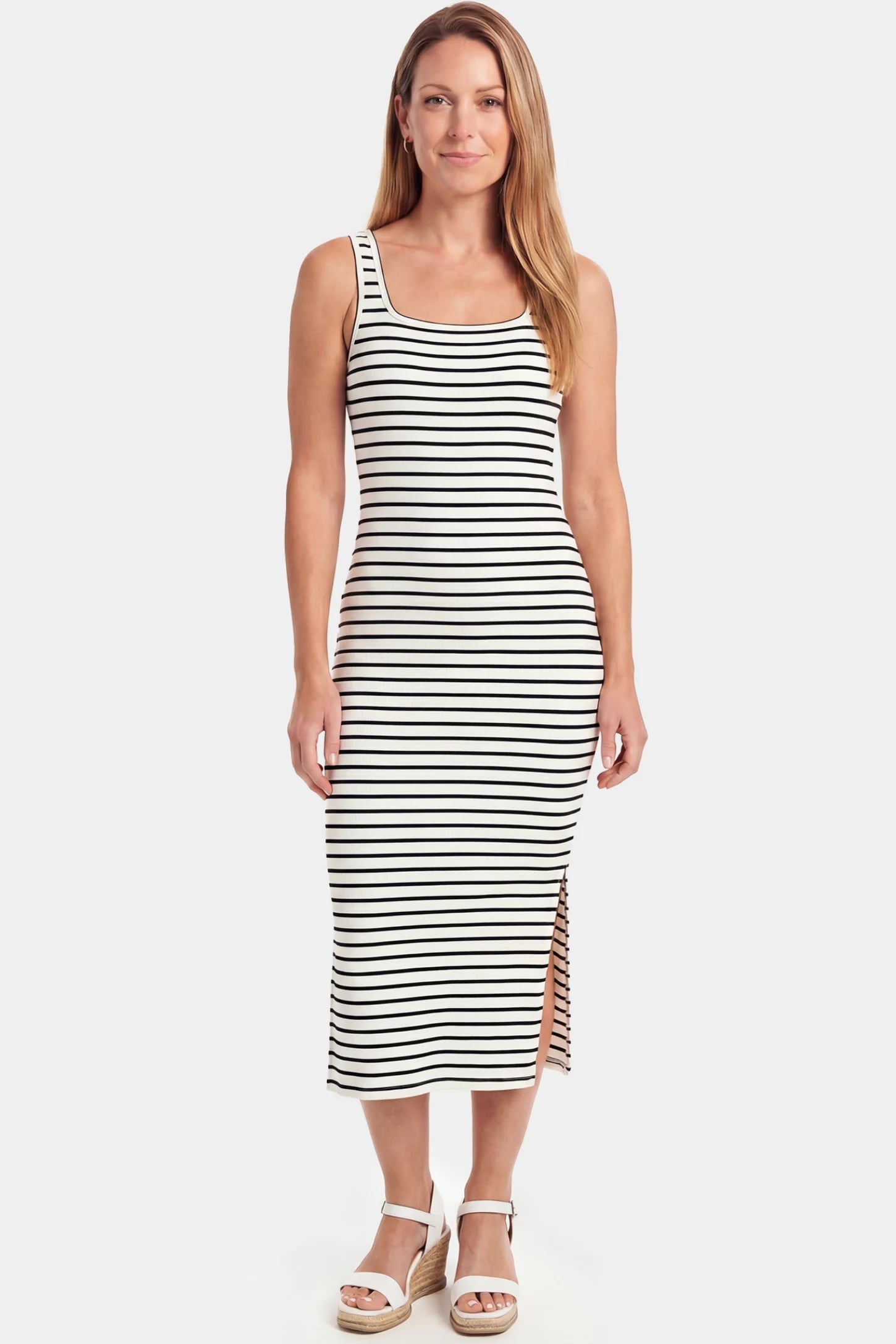 Striped Spaghetti Strap Side Slit Midi Maternity Dress Striped spaghetti strap side slit midi maternity dress in white featuring classic black-and-white stripes in front view on a postpartum model