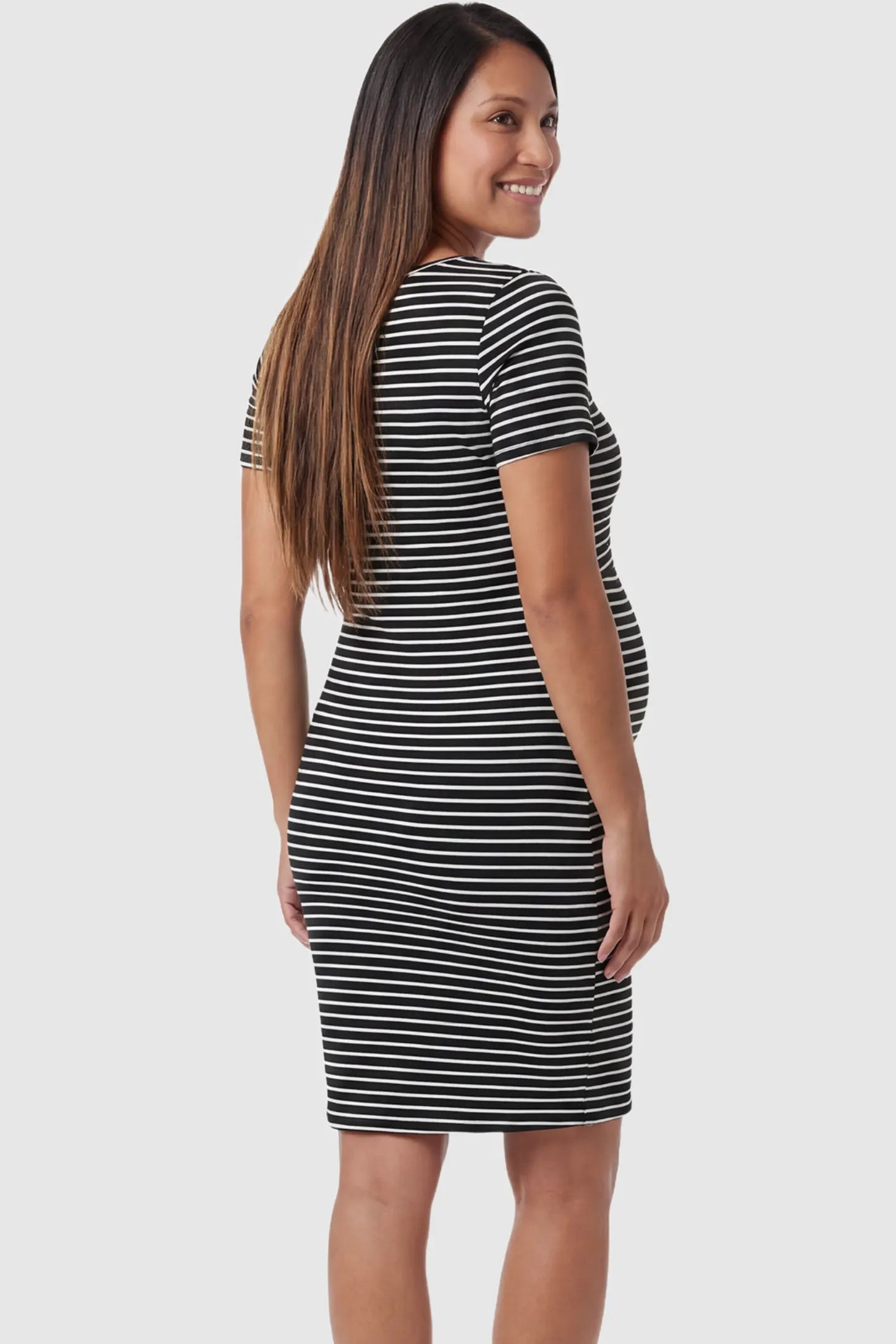 Striped Print Lift-Up Layers Maternity & Nursing Dress Striped print lift-up layers maternity and nursing dress in black with timeless striped casual elegance, back view on pregnant model