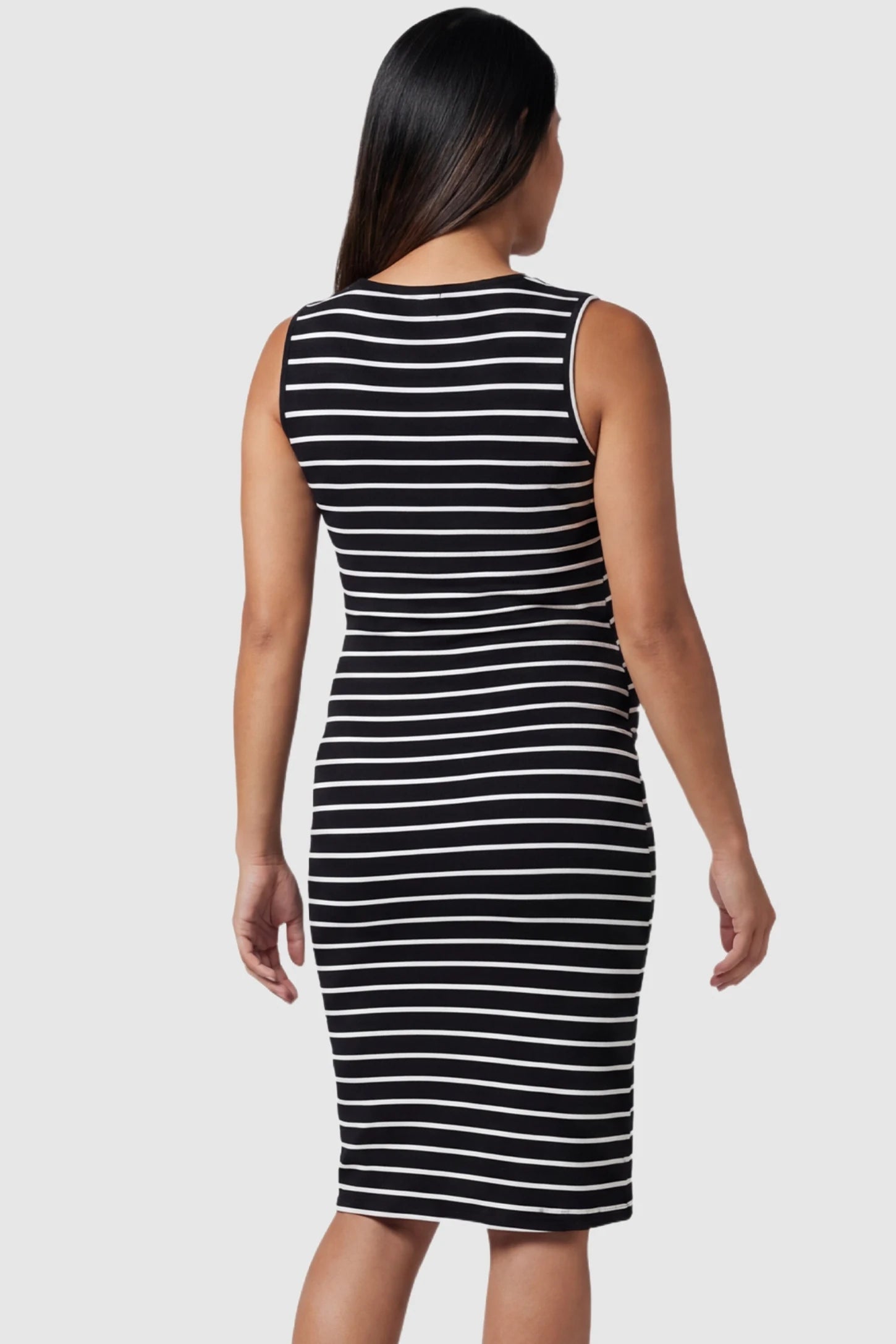Lift-Up Access Striped Sleeveless Bodycon Maternity & Nursing Dress Black and white Striped Sleeveless Bodycon Maternity & Nursing Dress showing the full-length back view on a pregnant model.