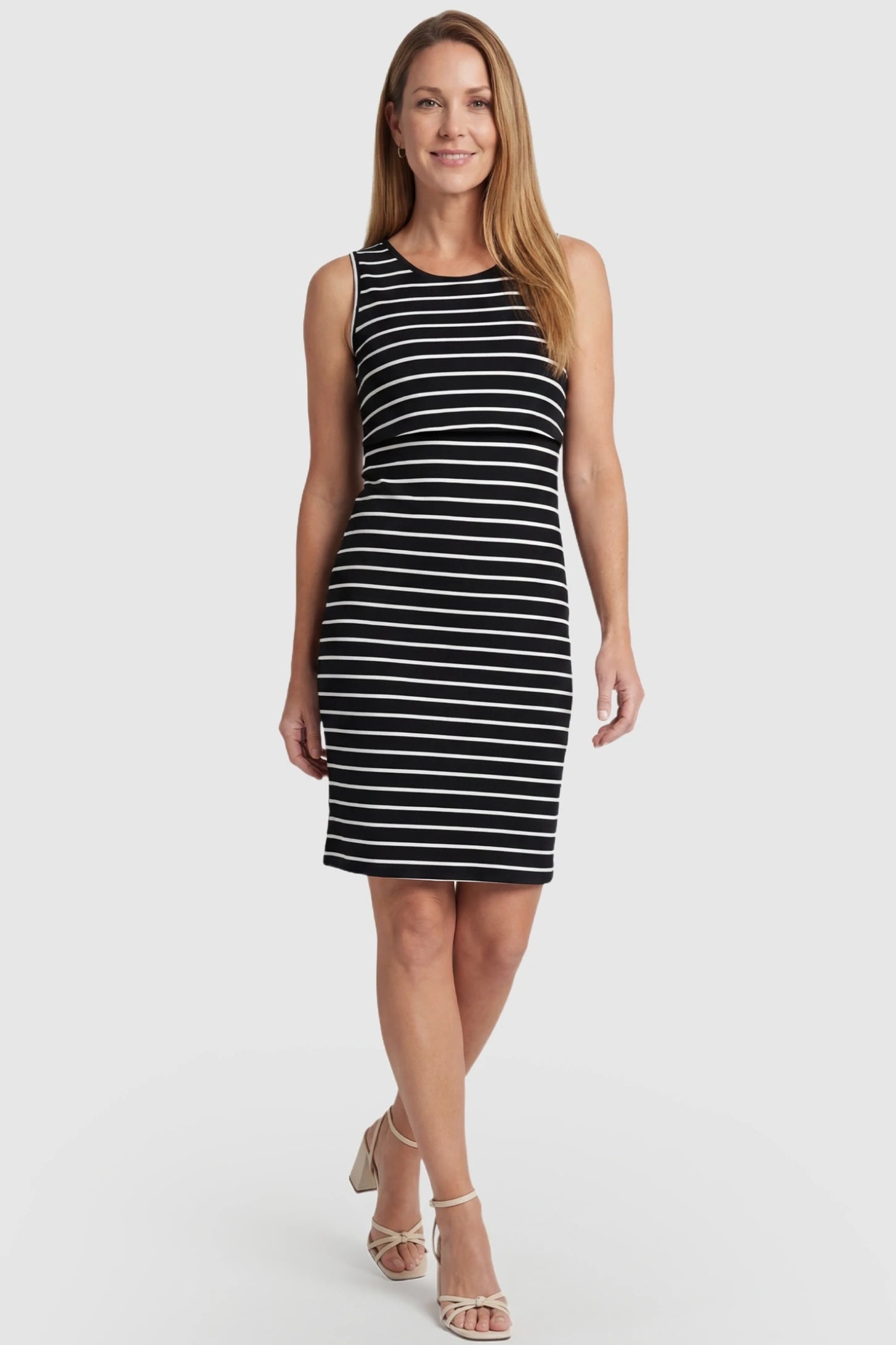 Lift-Up Access Striped Sleeveless Bodycon Maternity & Nursing Dress Striped Sleeveless Bodycon Maternity & Nursing Dress in black and white stripes on a non-pregnant model for postpartum wear.