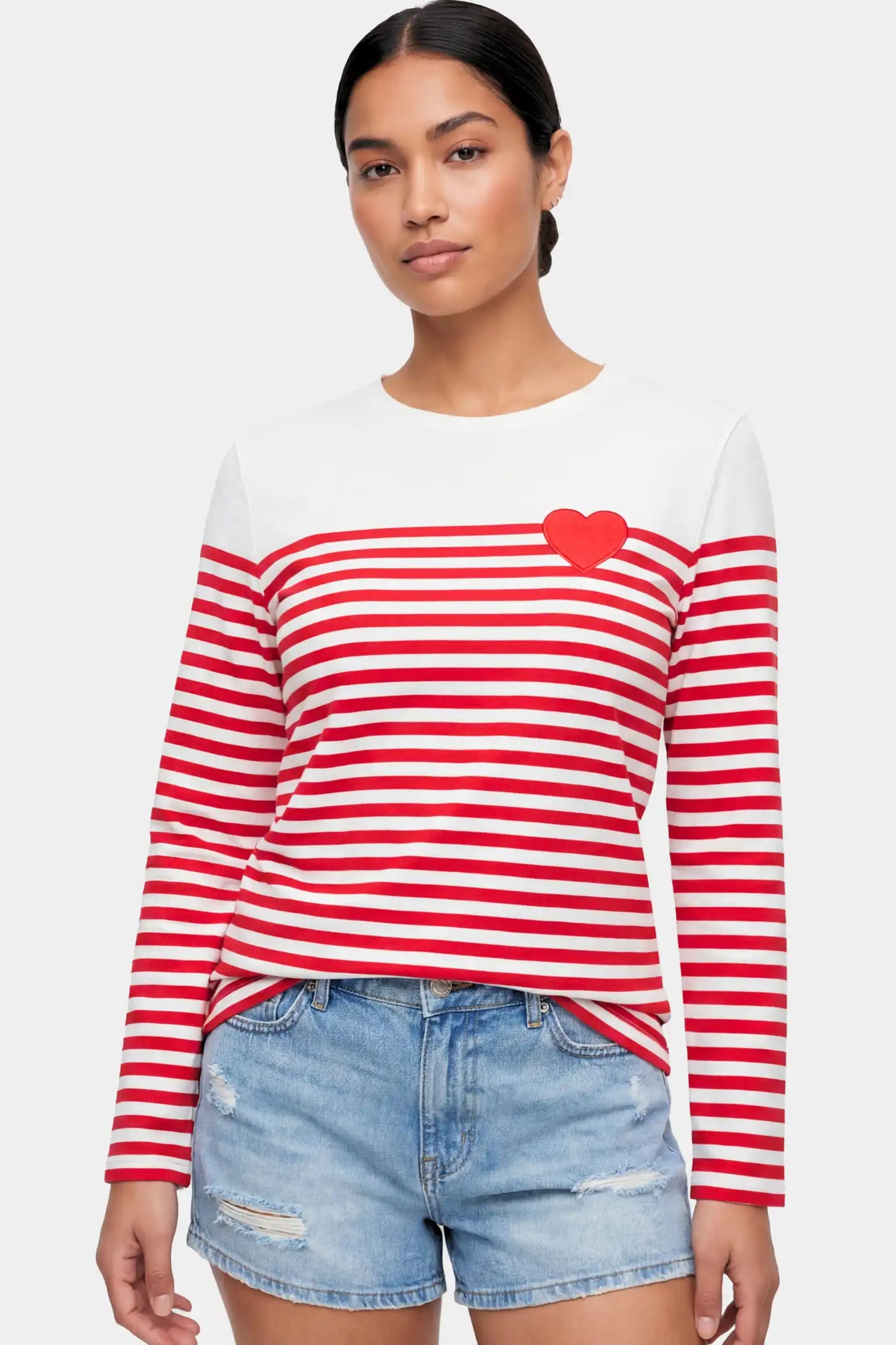 Striped Crew Neck Long Sleeve Maternity Top Striped Crew Neck Long Sleeve Maternity Top in red featuring a crew neck and heart detail on a non pregnant model.