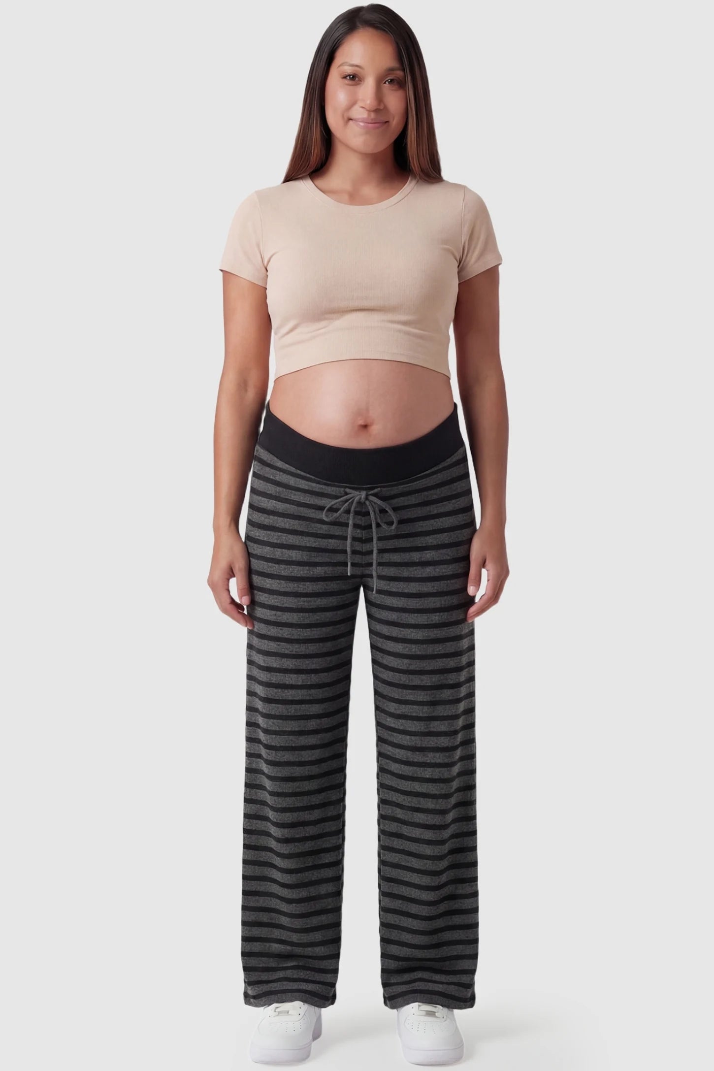 Striped Knit Drawstring Wide-Leg Maternity Pants in dark gray stripes featuring a stretchy knit blend on a pregnant model, in full body shot.
