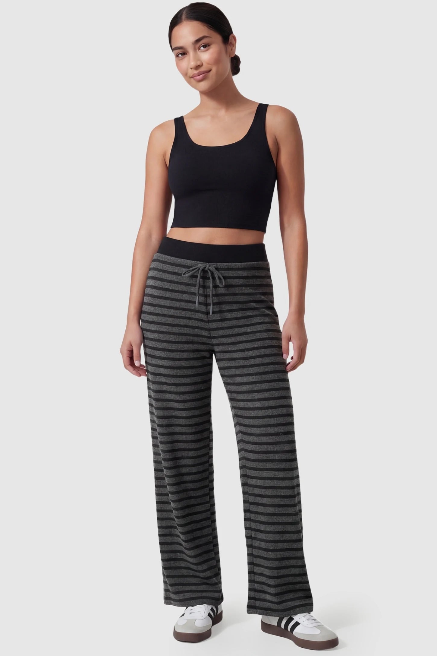 Striped Knit Drawstring Wide-Leg Maternity Pants Striped Knit Drawstring Wide-Leg Maternity Pants in dark gray stripes featuring a stretchy knit blend on a postpartum model, in full body shot.