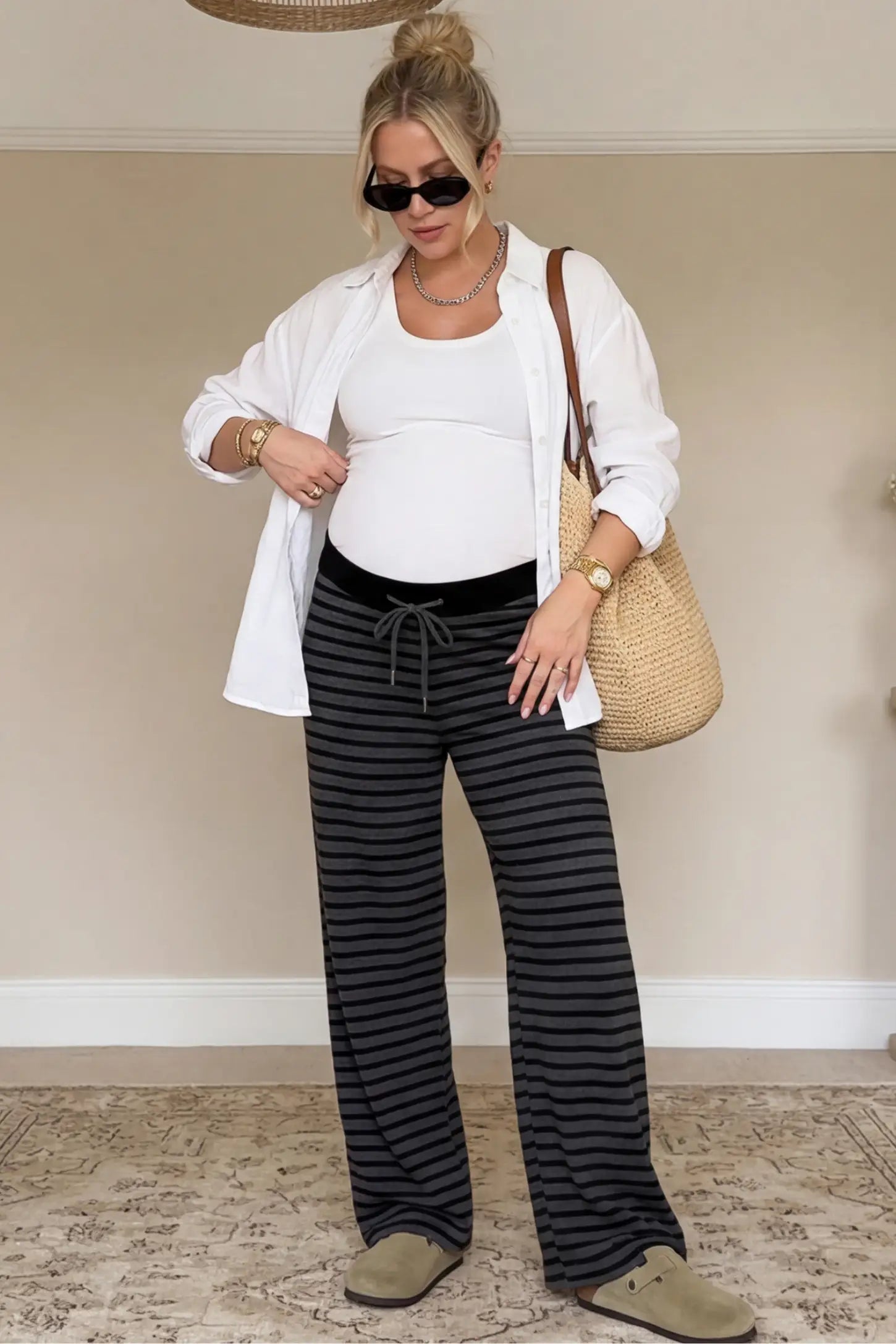 Striped Knit Drawstring Wide-Leg Maternity Pants Striped Knit Drawstring Wide-Leg Maternity Pants in dark gray stripes featuring a high-waisted fit on a pregnant model, 