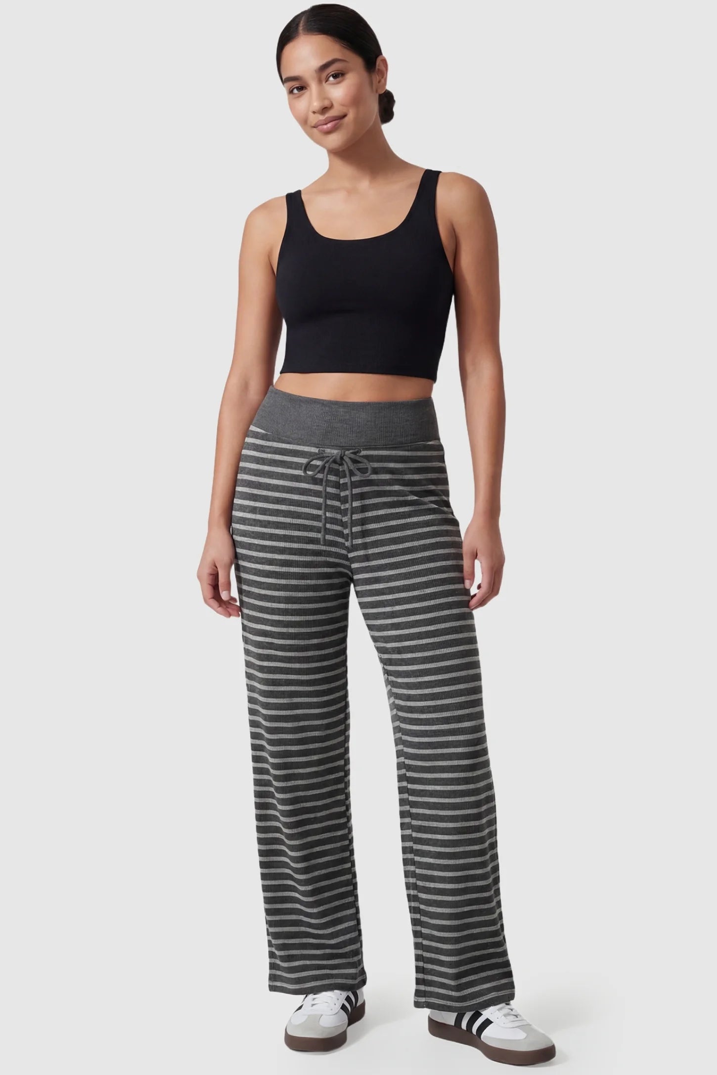 Striped Knit Drawstring Wide-Leg Maternity Pants Striped Knit Drawstring Wide-Leg Maternity Pants in light stripes featuring a soft, skin-friendly texture on a postpartum model, in full body shot.