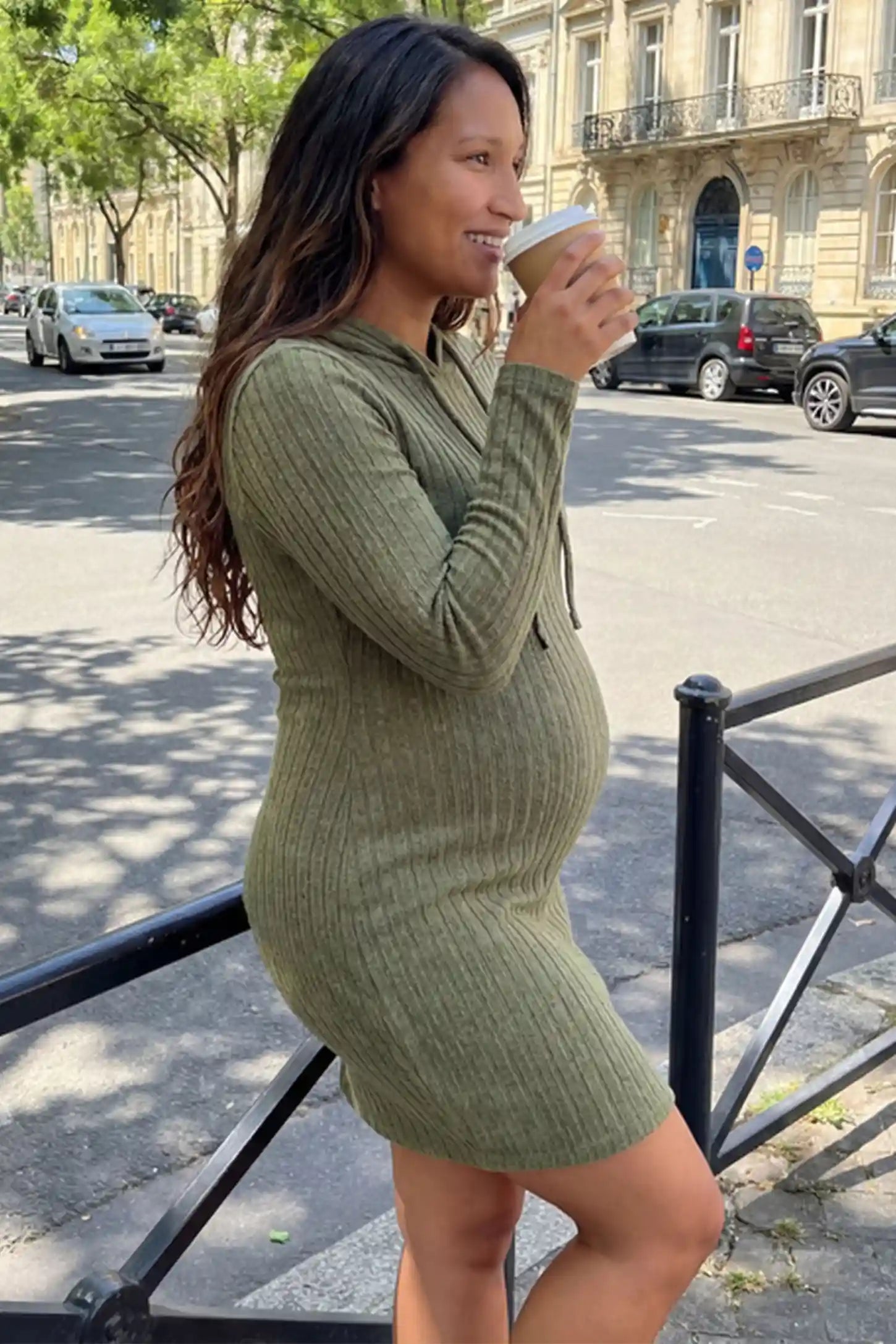 Ribbed Knit Hooded Maternity Sweater Mini Dress Ribbed Knit Hooded Maternity Sweater Short Dress in army green featuring drawstring hood and bodycon silhouette on a pregnant model.