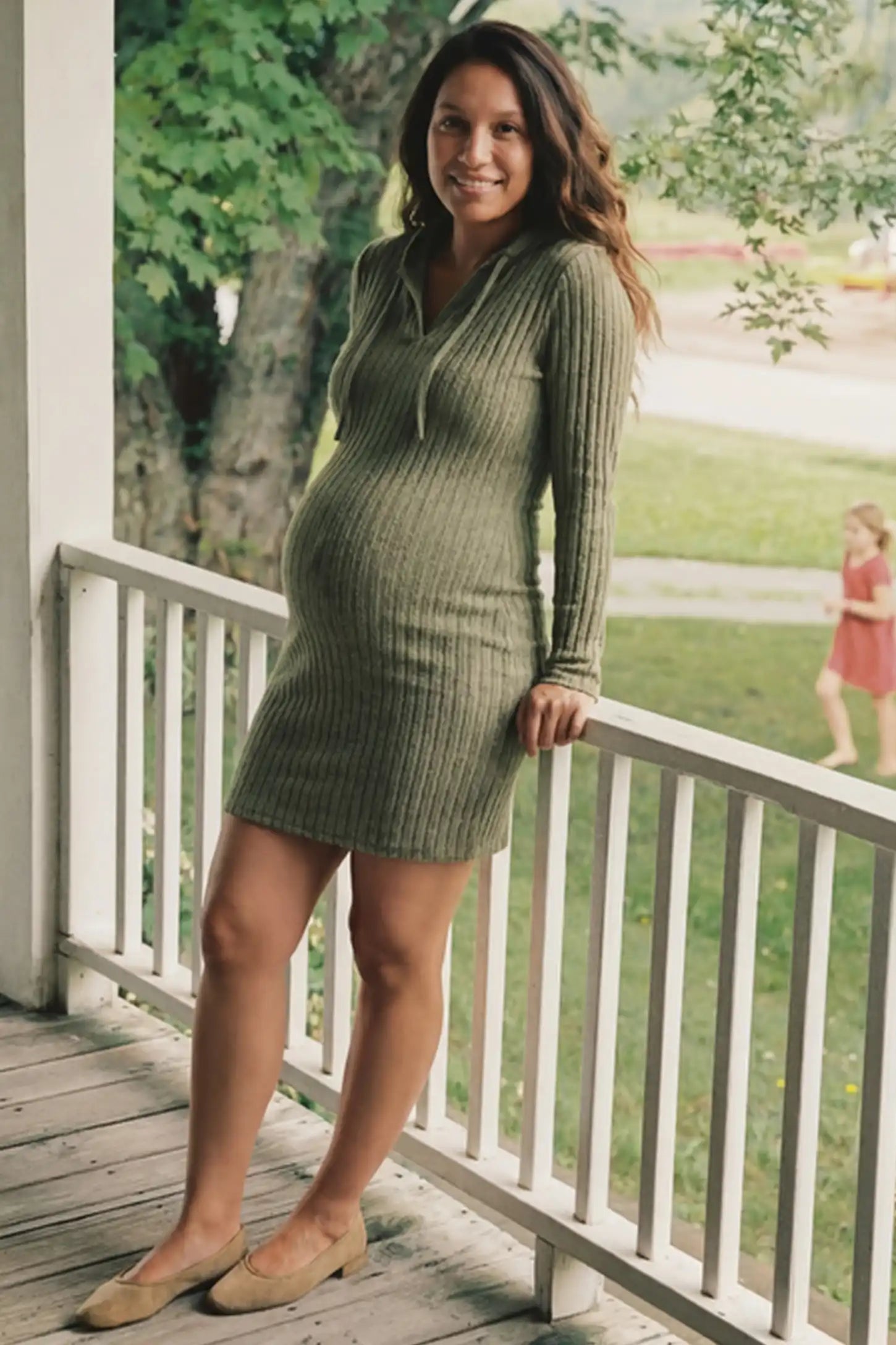 Ribbed Knit Hooded Maternity Sweater Mini Dress Ribbed Knit Hooded Maternity Sweater Short Dress in army green featuring drawstring hood and bodycon silhouette on a pregnant model.