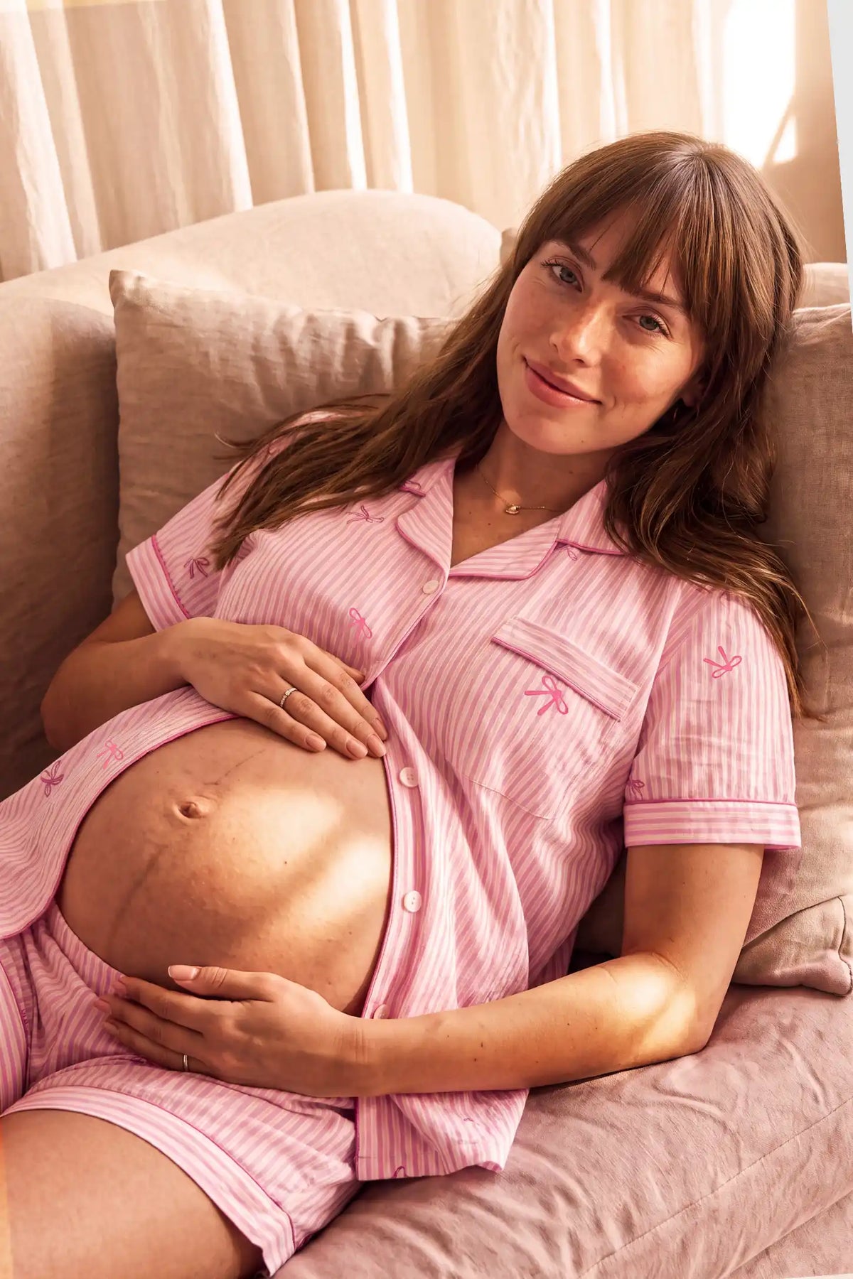 Sweet Ribbon Stripe Cotton Maternity PJ Set with Shorts & Pants Sweet Ribbon Stripe Cotton Maternity Pajama Set with Shorts & Pants in Pink Striped Bow featuring a cozy striped pajama design, ribbon bow print, lightweight fabric, and comfortable maternity loungewear style during a nursing moment.