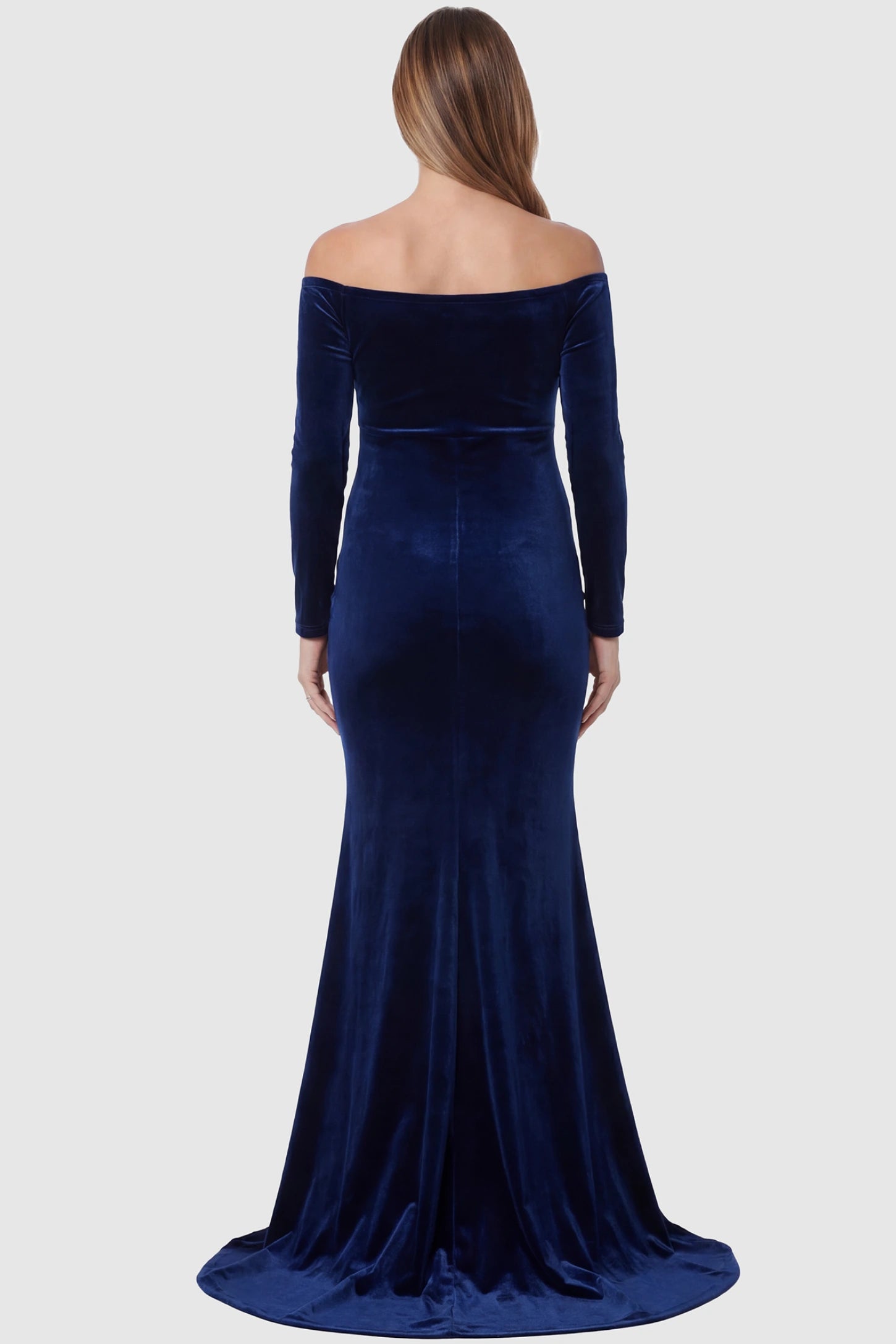 Velvet Long Fitted Sleeve Maternity Gown Velvet Long Fitted Sleeve Maternity Gown in navy blue featuring an off-shoulder sweetheart neckline, empire waist, and mermaid skirt on pregnant model back view.