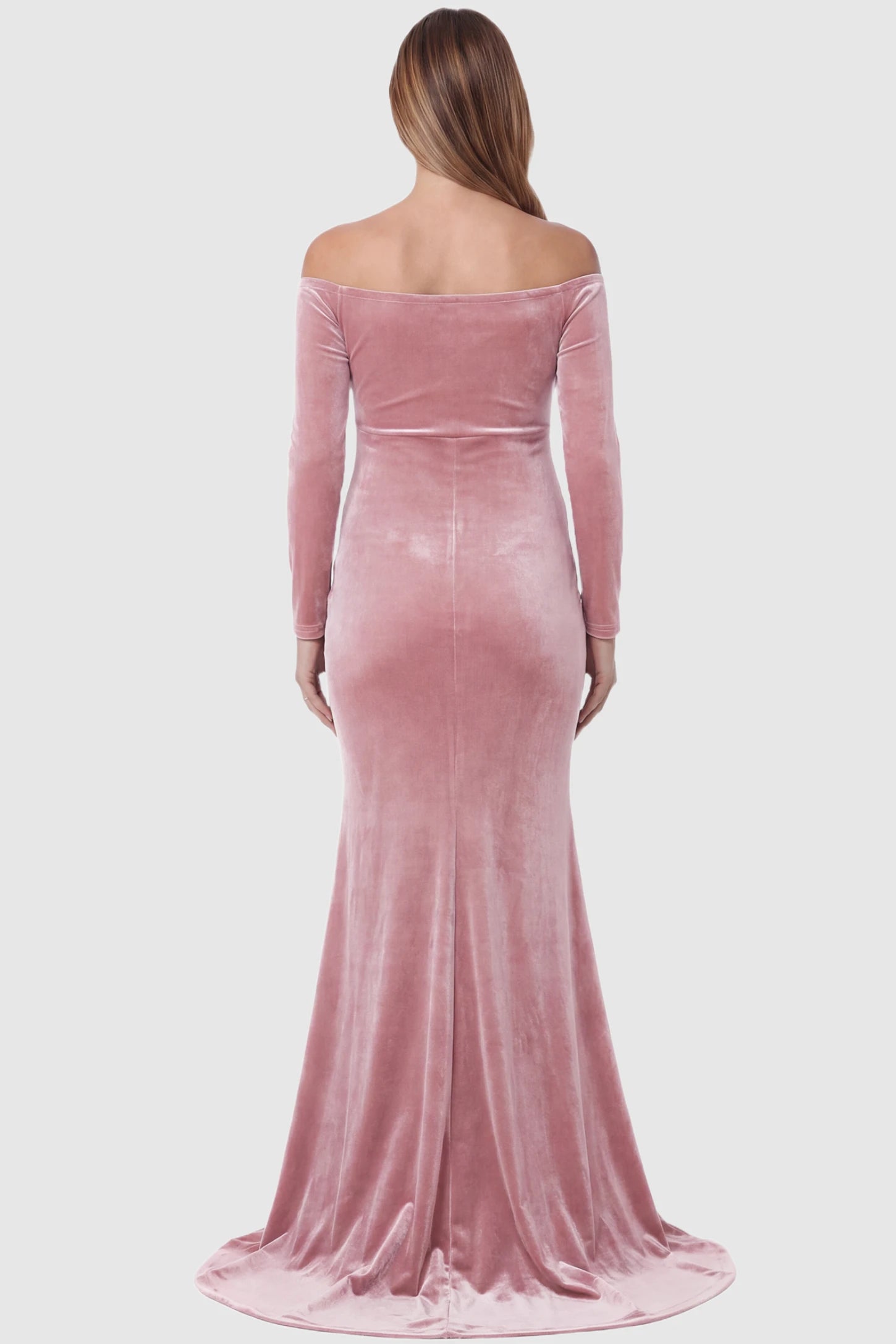 Velvet Long Fitted Sleeve Maternity Gown Velvet Long Fitted Sleeve Maternity Gown in pink featuring an off-shoulder sweetheart neckline, empire waist, and mermaid skirt on pregnant model back view.