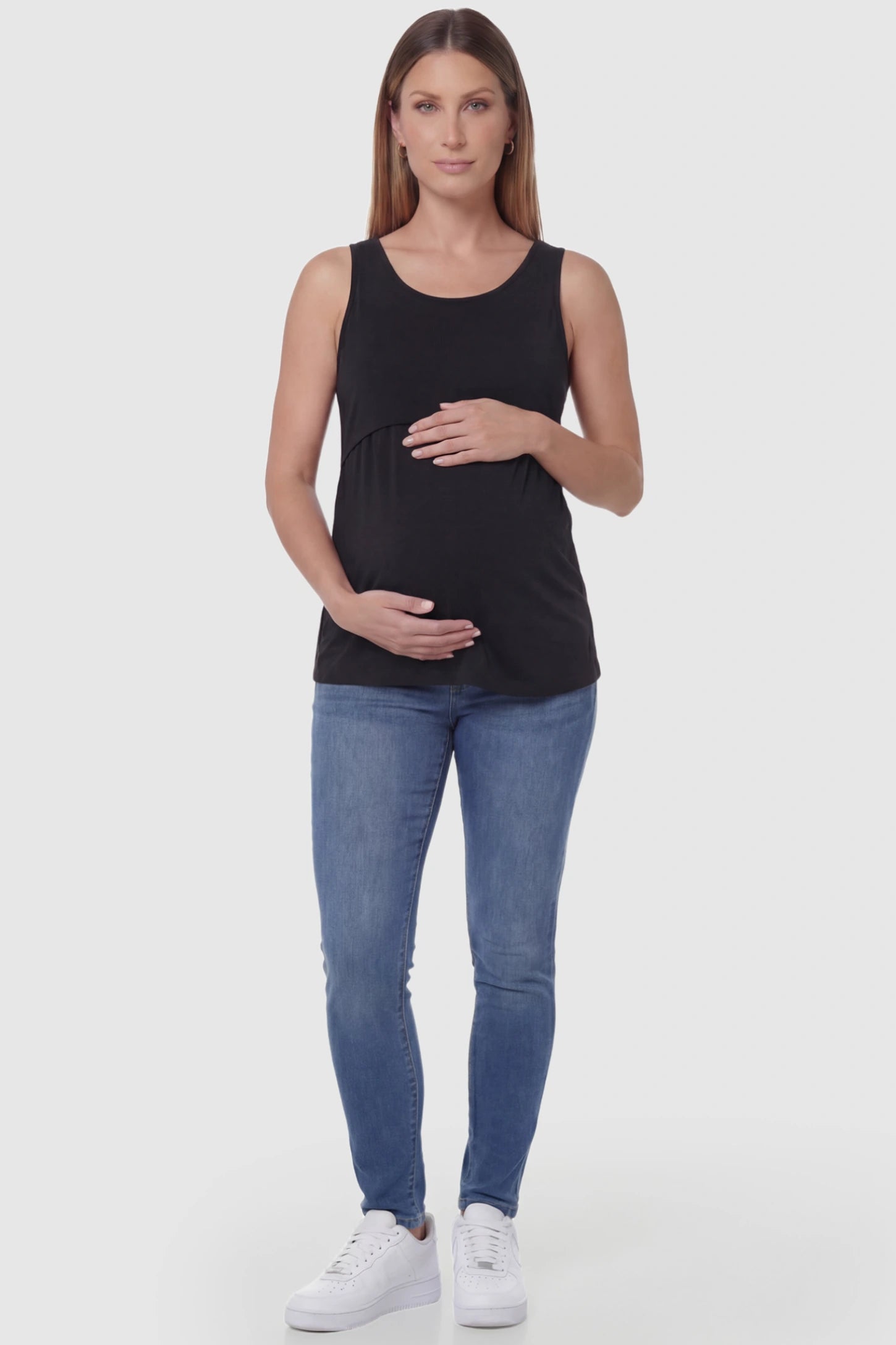 Basic Maternity & Nursing Tank Top Basic Maternity & Nursing Tank Top in black featuring a scoop neck and smooth, body-hugging fit on a pregnant model, full body view.