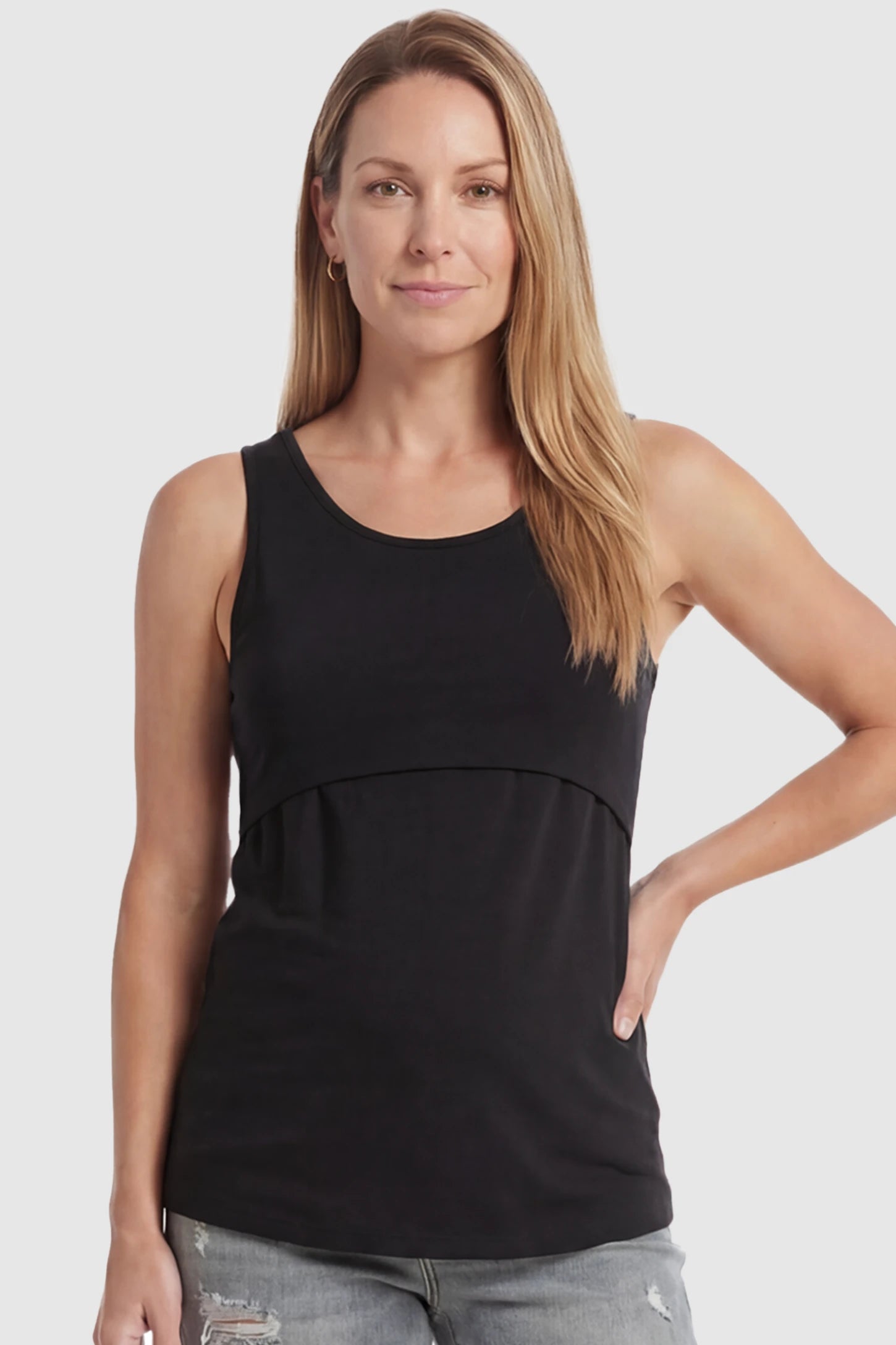 Basic Maternity & Nursing Tank Top Basic Maternity & Nursing Tank Top in black featuring a scoop neck and smooth, body-hugging fit on a postpartum model, front view.