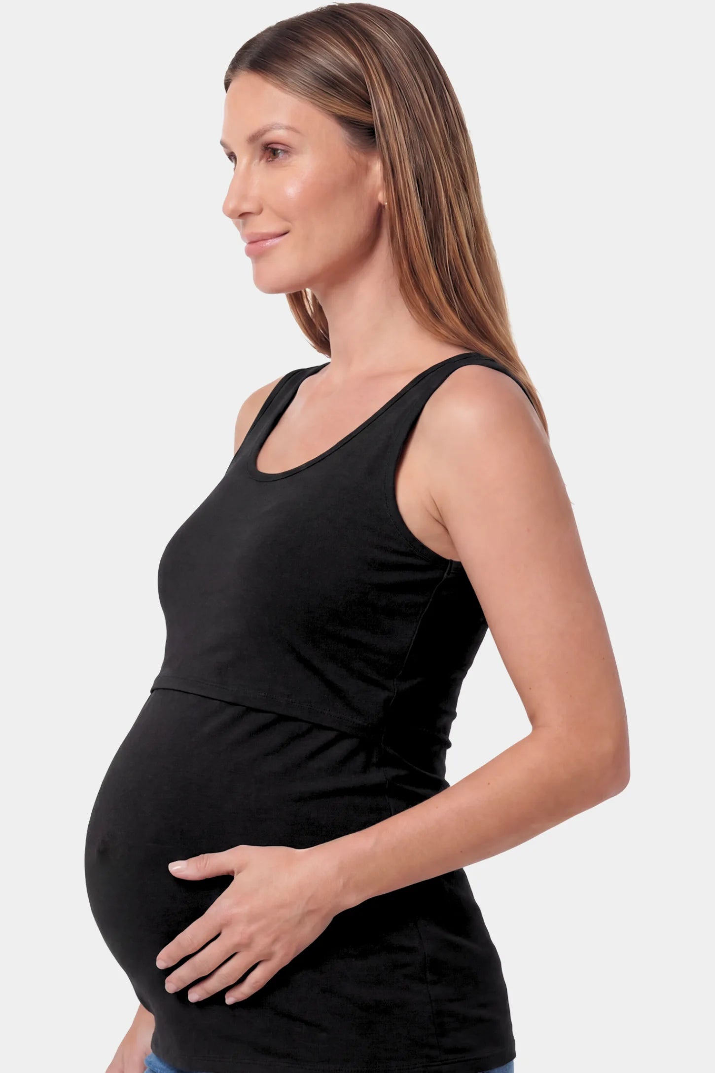 Basic Maternity & Nursing Tank Top Basic Maternity & Nursing Tank Top in black featuring a scoop neck and smooth, body-hugging fit on a pregnant model.