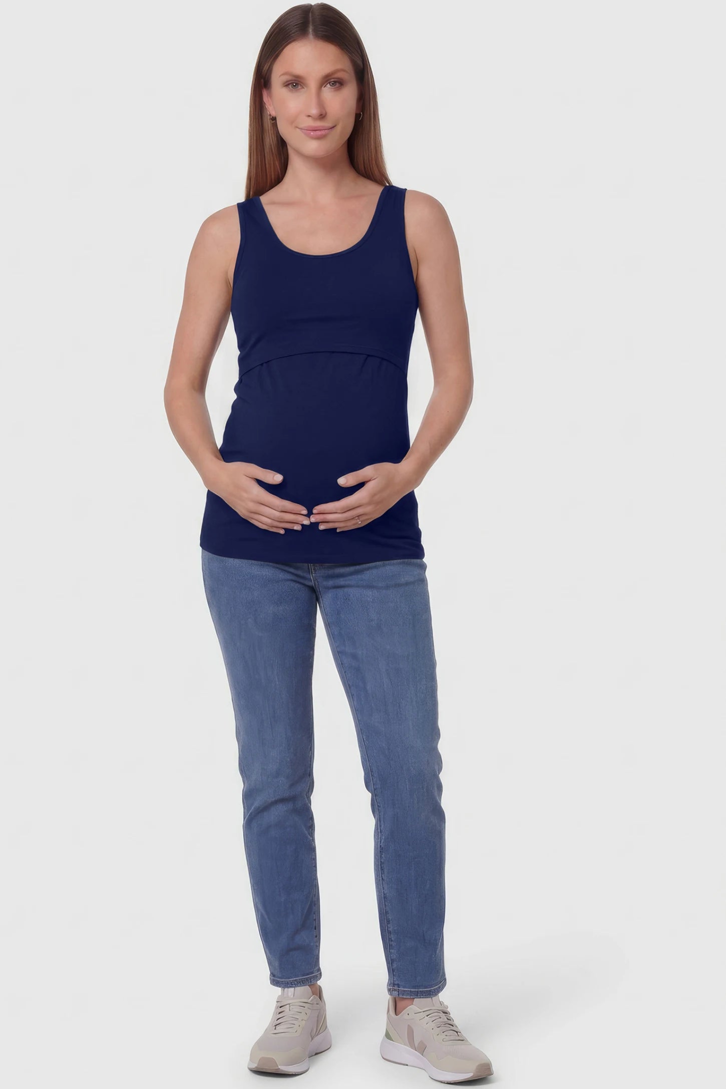 Basic Maternity & Nursing Tank Top Basic Maternity & Nursing Tank Top in dark blue featuring a scoop neck and smooth, body-hugging fit on a pregnant model.