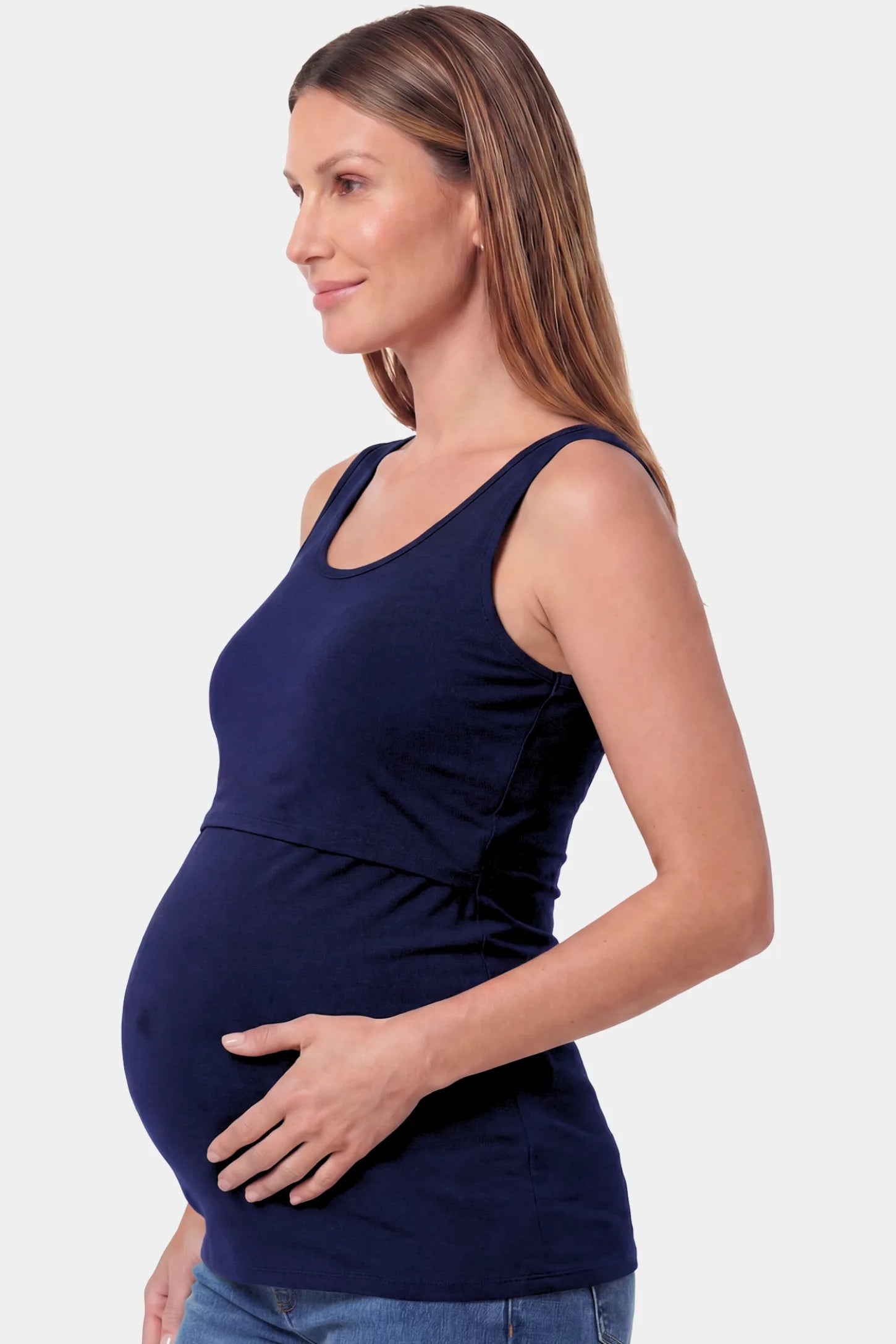 Basic Maternity & Nursing Tank Top Basic Maternity & Nursing Tank Top in dark blue featuring a scoop neck and smooth, body-hugging fit on a pregnant model.